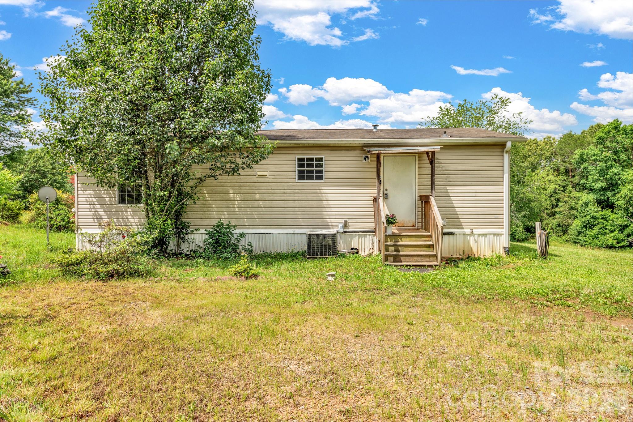 Investor special with excellent potential just 8 minutes from Weaverville! This recently subdivided double-wide sits on a generous lot and offers a great opportunity for investors, flippers, or buyers looking to renovate and make it their own. The home will require renovations and is being sold as-is. It is currently served by a shared well, with a shared well agreement in progress. The title has been retired, and the subdivision has recently been completed. Enjoy the peaceful setting, convenient location, and ample outdoor space with plenty of possibilities. Whether you're looking for your next investment project or a property to customize, this one is full of potential!
