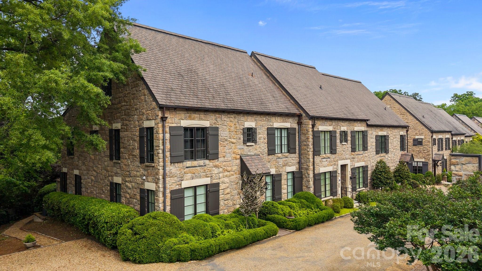 Stunning 3-story end-unit townhome in sought after Myers Park Chipping Campden community. This beautifully updated home offers a functional & flexible floor plan, tons of natural light and high-end finishes throughout. 
The main level features herringbone designed hardwoods, a sleek modern chef’s kitchen equipped with Bertazzoni stainless steel ovens/range & custom cabinetry providing plenty of storage—ideal for both daily living and entertaining. The spacious family room and sitting area flows seamlessly to a private outdoor patio, perfect for morning coffee or alfresco dining. Upstairs, retreat to a spacious primary suite complete with a spa-inspired en-suite bathroom and walk-in closet. Two additional bedrooms with en-suite baths, laundry room & 3rd floor bonus/studio area offers flexibility to make this beautiful home your own. Don't miss the 2-car detached garage & one of its kind community English gardens - with a beautiful courtyard & stone fireplace!