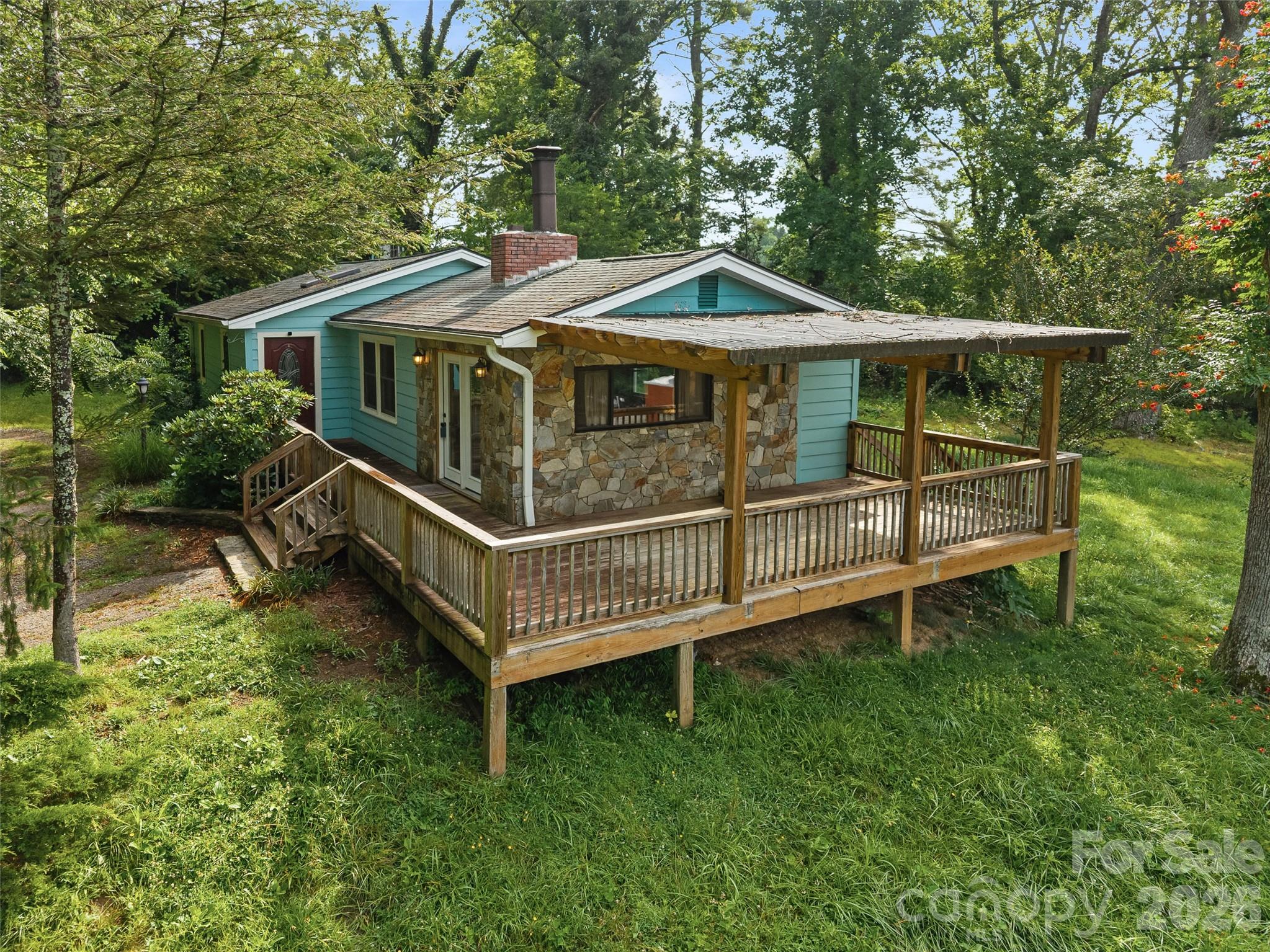 This charming bungalow is located right in the sweet spot.  Minutes from downtown, outside city limits, and freshly painted, the new owners will love all 1705 Willow Rd. offers.  The immediate neighboring land is owned by the Hendersonville Country Club, so setting up from Willow gives this home a sense of hidden privacy.  The septic permit is for a 3 bedroom home, currently a 2 bedroom, bath and a half, the possibilities are endless.  The small basement is accessible from the inside and offers extra storage.  Priced to sell and ready for new owners to enjoy as much as the sellers have the last several years.  The half bath offers storage and potential for upgrading to full bath with the right set up.  The deck and outdoor space offer a place to relax, cook, entertain and simply enjoy the outdoors after a long day away.