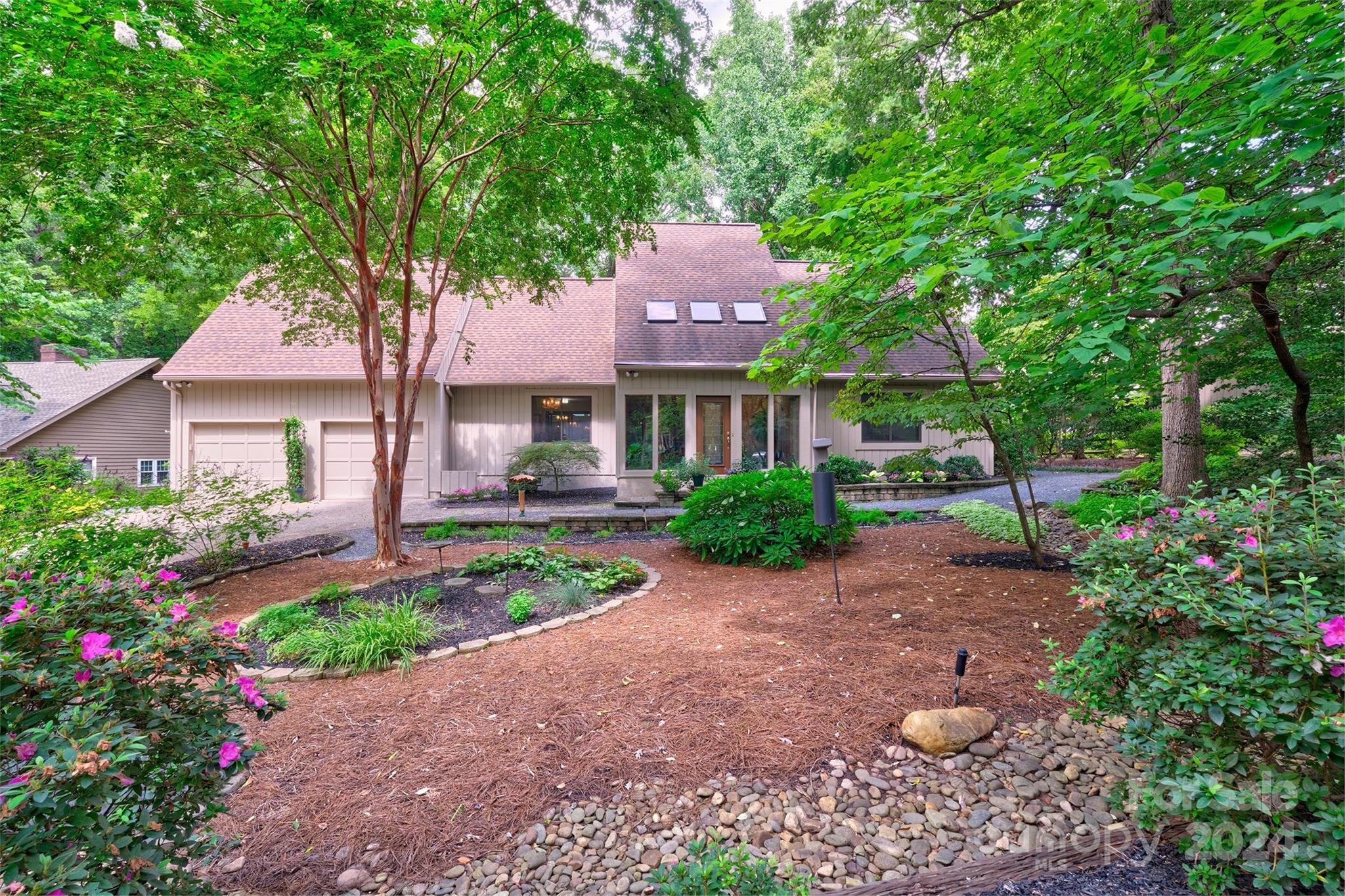 PRICE IMPROVEMENT! Seller offering $8000 toward rate buy down! Welcome home to the most amazing yard!Private backyard w/ gravel pathways and beautiful waterfall!Walk out the sunroom door and you are transformed to a feeling of zen!Lovely 3 bedroom,2 bath home w/ 4 season sunroom in the heart of the neighborhood & quiet street.Updated Kitchen & built in butler pantry/hutch.Cathedral ceilings in the great room.The one has great flow for throwing parties.Oversized garage with built in shelving for all your planting needs! This home also offers a solarium at the front door to bring the outdoors in and all the natural light.The home has its own well (very few have this in the neighborhood) and full yard irrigation.River Hills is a waterfront and golf community that has so much to offer!Miles of walking trails, gardens, playgrounds, marina, country club, dog park and waterfront park that has a sandy beach, picnic pavilion and awesome views! Just WOW on this unique home. Welcome to the lake!