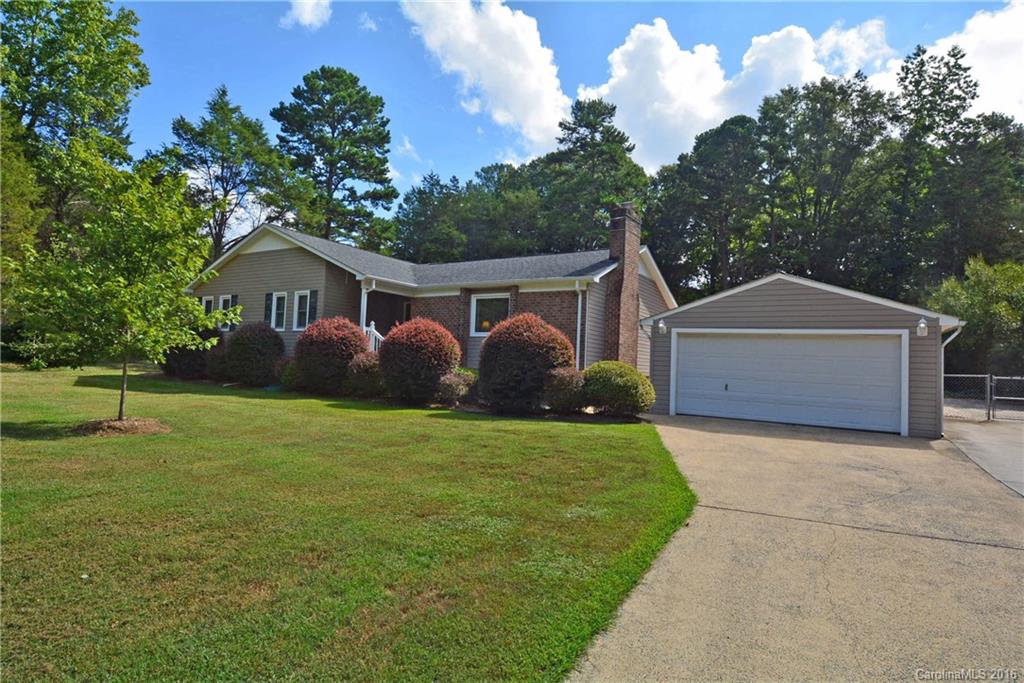 Welcome home! Vaulted great room, remodeled kitchen with granite, large formal dining room, and 3 bedrooms, 2 full baths in this ranch style home.  Beautiful home inside!  But you'll spend all of your time outside on the covered deck or enjoying the pool in the privacy of your backyard.  2 car detached backyard plus storage building.  Gorgeous setting with no city taxes!