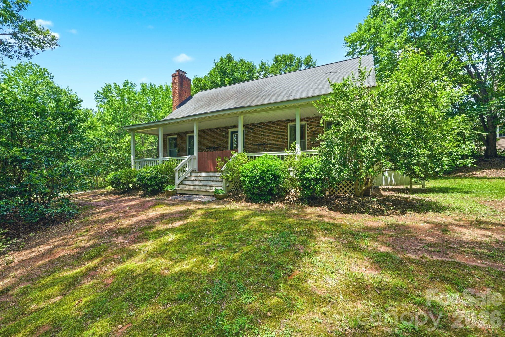 Tucked away on over an acre surrounded by mature trees, this private retreat offers the perfect blend of peaceful country living and everyday convenience. Located in the highly desirable Indian Land/Fort Mill area, 9143 Sadlers Ridge Road features 4 bedrooms, 2.5 bathrooms, and over 2,000 square feet of comfortable living space designed for both relaxation and entertaining.

Inside, you’ll find an open floor plan with spacious living areas, a dedicated dining space, and plenty of room to make the home your own. The primary suite is conveniently located on the main level and features a large soaking tub, separate shower, and relaxing atmosphere. Upstairs, additional bedrooms and flexible nook spaces provide endless possibilities for a home office, playroom, reading area, or bonus hangout space.

Adding even more potential, the home also includes an additional 1,200+ square feet of unfinished basement space — ideal for future expansion, a workshop, home gym, storage, or creating the custom space you’ve always wanted.

Step outside and enjoy the privacy and tranquility this property offers, with wooded surroundings and room to spread out. Whether you’re looking for space to entertain, garden, or simply enjoy quiet evenings outdoors, this property delivers.

Conveniently located near shopping, dining, and major commuting routes while still offering the feel of a secluded retreat, this home is a rare opportunity in one of the area’s fastest-growing locations. Home being sold As Is.