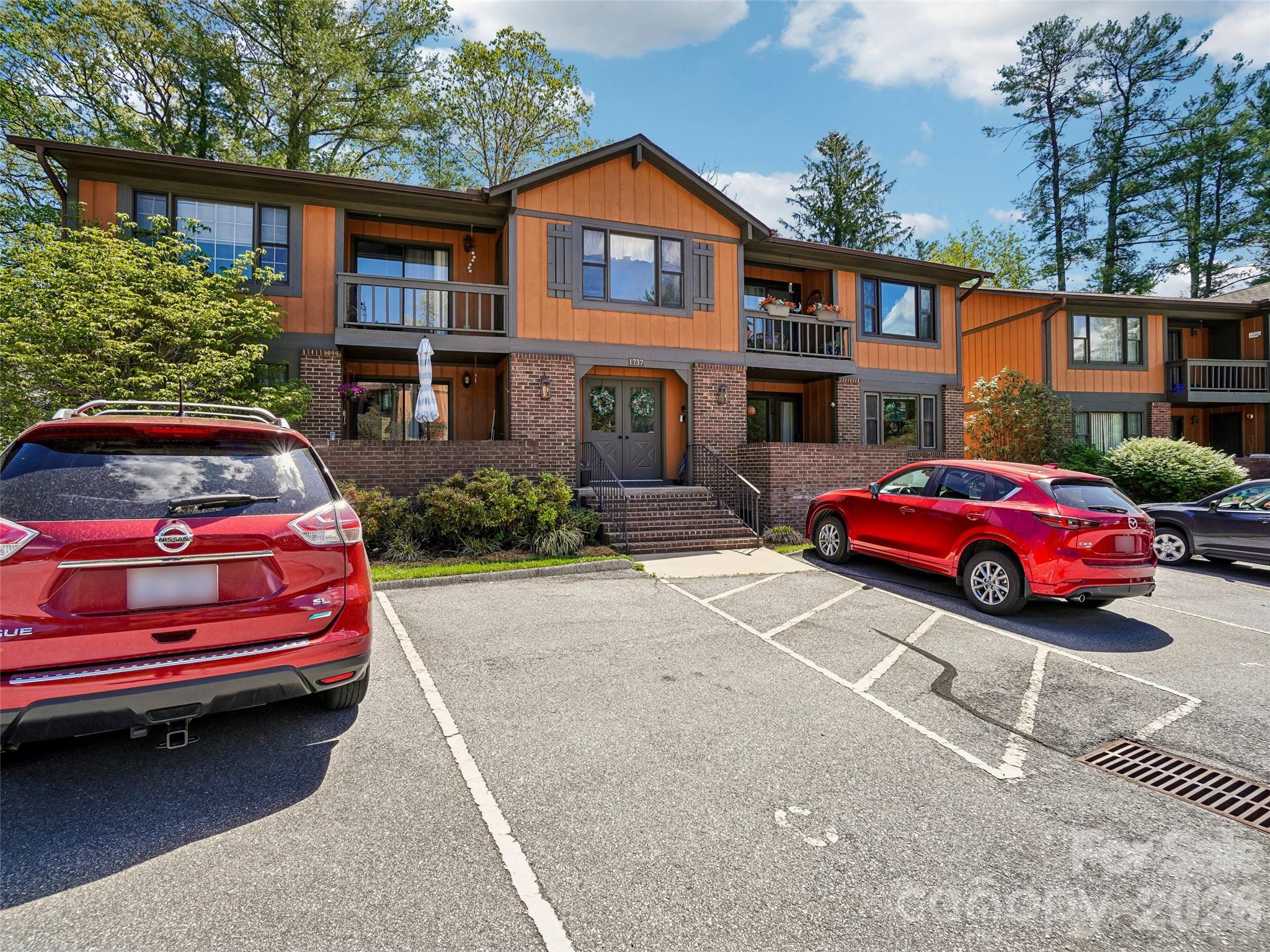 This beautifully updated, end-unit main-level condominium in Haywood Manor is just minutes from downtown Hendersonville's Main Street, offering convenient access to shopping, dining, Pardee Hospital, and Wingate University's Hendersonville campus. Nearly every aspect of this inviting home has been renovated. Step into a spacious living room that flows seamlessly onto a comfortable outdoor patio and also connects to the adjoining dining area. The expansive kitchen boasts freshly painted cabinets, granite countertops, new stainless-steel appliances, and a generous walk-in pantry. The large primary bedroom features direct entry to a private screened porch, while its newly remodeled bath includes a stylish walk-in shower and a space-saving sliding barn door. The guest bedroom is also roomy, with direct access to the also newly updated guest bathroom complete with another new shower. Both bedrooms are equipped with walk-in closets. Additional storage options include a sizable hall linen closet, a patio storage closet, and extra storage in the detached one-car garage space included with this property. Throughout the home, you'll find new LVP, tile, and carpeted flooring, fresh interior paint, brand-new lighting and ceiling fans, and updated plumbing fixtures. With nearly everything redone, all that remains is for you to enjoy comfortable, in-town living!