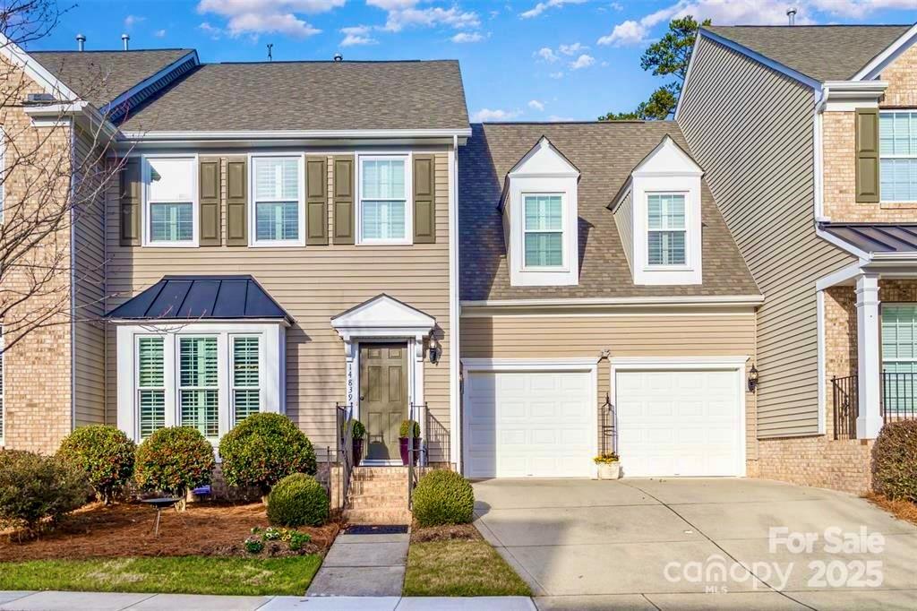 Get ready to fall in love with this meticulously maintained 3-bedroom, 2.5-bathroom townhome with unbeatable features! PRIMARY SUITE on MAIN is a true retreat, offering a garden tub, walk-in shower, dressing table vanity, private water closet, and a spacious walk-in closet equipped with a custom closet system. Steps away from the laundry room. Upstairs, you’ll find two additional bedrooms, a full bath, and a versatile loft perfect for a home office or cozy retreat.
Gleaming hardwood floors and oversized windows filling the space with warmth and light. The upgraded kitchen features a large island, ample storage, tasteful finishes, and a convenient butler’s pantry for additional prep space and organization.

Outside, you'll have your own private oasis with a garden courtyard and patio, ideal for relaxing or entertaining. Attached garage includes storage system and Tesla charger.

Check out the feature sheet for the full list of upgrades, and prepare to make this stunning home yours.