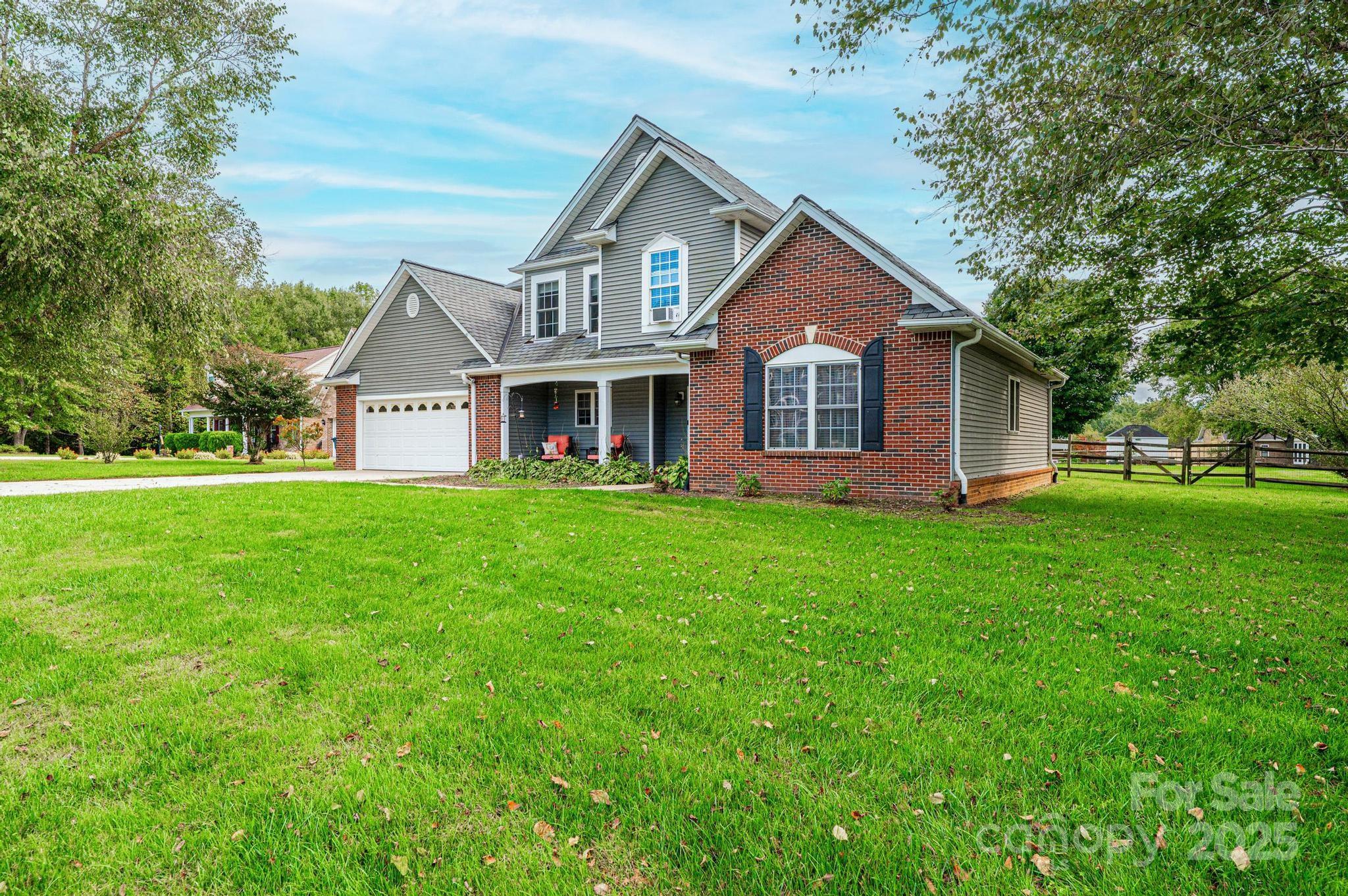 Welcome to 1472 Sweetbriar Lane — where stunning views of Bakers Mountain meet the comfort and space your buyers have been searching for!
Nestled at the quiet end of the street on a beautifully level, fully fenced .49-acre lot in the sought-after Bakersview Meadows subdivision, this 4-bedroom, 2.5-bath brick and vinyl beauty checks every box. Built in 1999 and lovingly maintained, this 1.5-story home offers 1,983 square feet of above-grade living space — plus an impressive 557 sq ft attached garage with extra storage to boot.
Step inside and you'll immediately notice the rich hardwood floors that flow throughout the main level. The spacious family room is anchored by a cozy gas log fireplace — perfect for those cool western Carolina evenings. The kitchen delivers an abundance of cabinetry, and the open layout makes entertaining a breeze. The main-level primary suite offers privacy and convenience, while three generously sized bedrooms upstairs share a full bath — ideal for families, guests, or a home office setup.
Out back, soak in the mountain views from your patio while enjoying the fully fenced yard — a rare find at this price point. With a concrete driveway, garage door opener, and a publicly maintained road, the practical details are all taken care of too.
Major systems include a heat pump, central air, city water, and an installed septic system. HOA fees are just $25 annually — practically nothing for the community and location you're getting.
 Ready to move — don't let this one slip away!