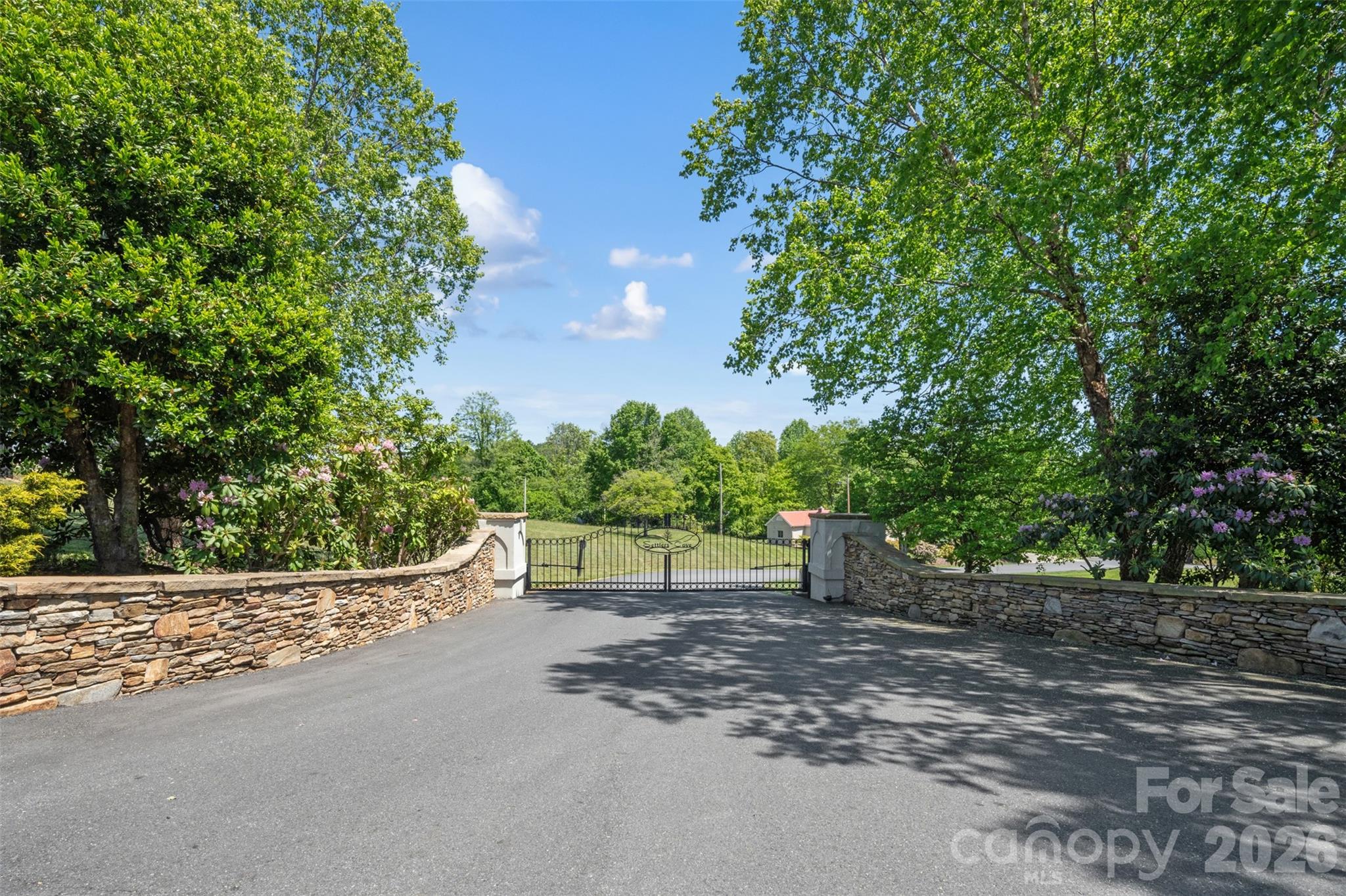 Discover the perfect setting for your mountain retreat on Lot 26 in the desirable gated community of Settlers Cove in Mars Hill. This gently sloping homesite offers an ideal build site with the potential for stunning long-range mountain views. Surrounded by the natural beauty of Western North Carolina, this lot combines privacy, serenity, and convenience in one exceptional package.

Settlers Cove is a covenant-protected community known for its peaceful setting, abundant wildlife, and quality homes. Electric utilities are readily accessible, and the community’s architectural review process helps maintain consistent quality and aesthetic appeal throughout the neighborhood. Conveniently located just 5 minutes from downtown Mars Hill and Mars Hill University, and only 25 minutes to vibrant Asheville, this beautiful homesite offers the perfect balance of mountain living and modern convenience.