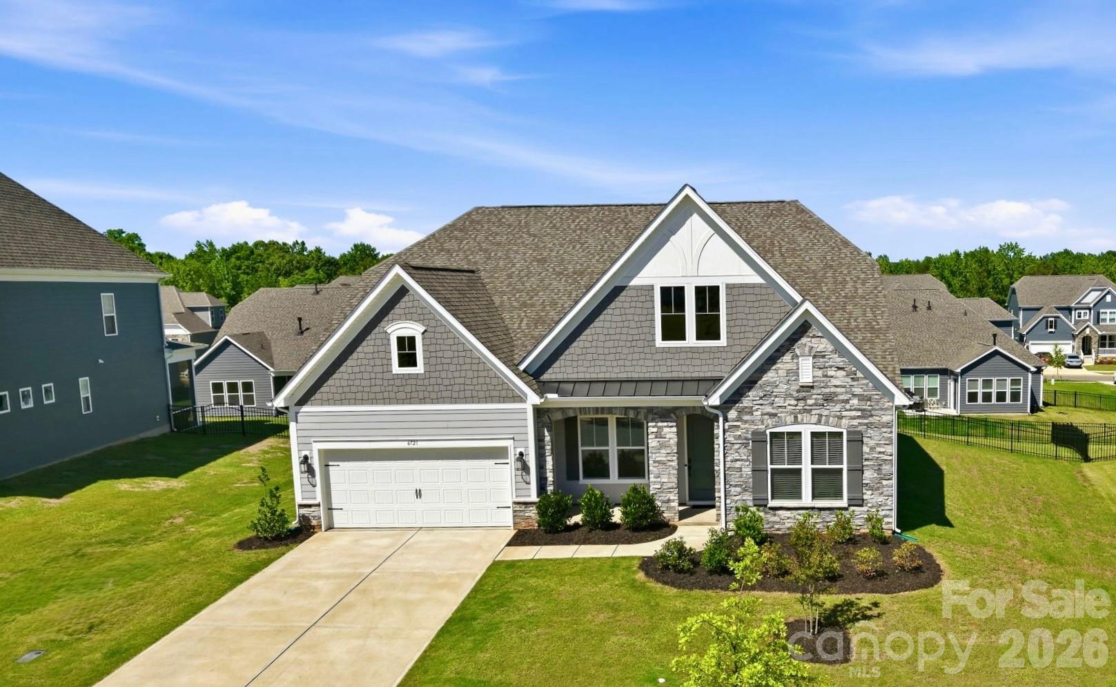 There’s a reason the Whitmore II is one of the most popular Taylor Morrison floor plans in America, it simply works. Thoughtfully designed for the way people actually live, this nearly new home built in 2025 combines open-concept living, flexible spaces, and a highly sought-after primary suite on the main level.

From the moment you step inside, you’ll appreciate the bright, airy layout and effortless flow. The heart of the home is the expansive kitchen, complete with a large gathering island that overlooks the dining area and spacious family room, making entertaining feel natural and easy. Whether you’re hosting the holidays, cheering on your favorite team, or enjoying a quiet evening at home, this floor plan adapts beautifully to every stage of life.

The main-level primary suite feels like a private retreat with a spa-inspired bath, oversized shower, dual vanities, and generous walk-in closet with custom built-ins. Two additional bedrooms and a flex room on the main level provide endless possibilities for guests, a home office, fitness room, playroom, or hobby space.

Upstairs, you’ll find even more room to spread out with a versatile loft, an additional bedroom with a full bath, and a huge bonus room perfect for movie nights, gaming, multigenerational living, or a second home office.

Outside, enjoy a private fenced backyard with plenty of room to relax, entertain, garden, or let pets play. Directly across the street, you’ll enjoy one of the community’s most charming amenities, a spacious, tree-lined central park featuring a covered pavilion, inviting park benches, and plenty of green space to relax, gather with neighbors, or enjoy a peaceful evening stroll. This open green space creates a picturesque setting and an extension of your own front yard.

Located in The Estates at Sugar Creek, one of Indian Land’s most desirable areas, where you’ll enjoy easy access to shopping, dining, medical care, golf, recreation, and everyday conveniences. Plus, you’re just 10 minutes from the Ballantyne Bowl, one of the Charlotte area’s newest chic lifestyle destinations featuring restaurants, breweries, coffee shops, walking trails, entertainment venues, and year-round community events.

Top-rated schools, low South Carolina taxes, an incredibly functional floor plan, extended garage for additional storage, and a location that’s hard to beat. This one checks all the boxes.