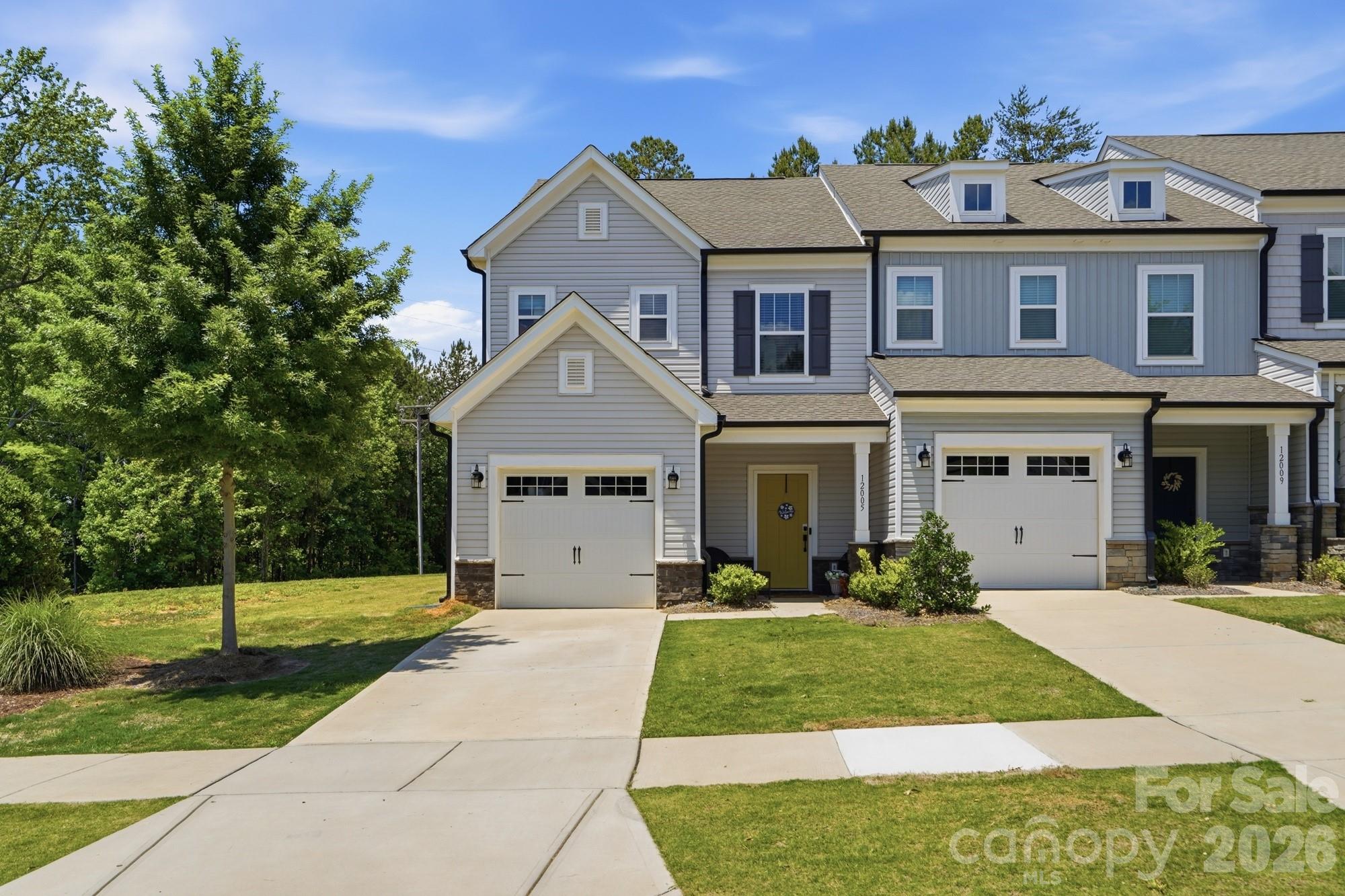 Welcome Home! End-unit living with the privacy you didn't think was possible in a townhome. 12005 Basking Drive offers a thoughtfully designed layout in The Landings at Catawba River, with a tree-lined private backyard that makes this one a standout.

The open-concept main level is bright and welcoming, featuring LVP flooring throughout, quartz countertops, and stainless steel appliances, everything move-in ready and done right. The kitchen flows naturally into the living area, making everyday living and entertaining feel effortless.

Upstairs, the primary suite is a true retreat with a walk-in closet and oversized shower. Two additional bedrooms, a second full bath, and an upper-level laundry round out the second floor. A one-car garage and a private backyard backing to trees complete the package.

Minutes to the U.S. National Whitewater Center, Mountain Island Lake, and I-485 for an easy commute to Uptown Charlotte and beyond.