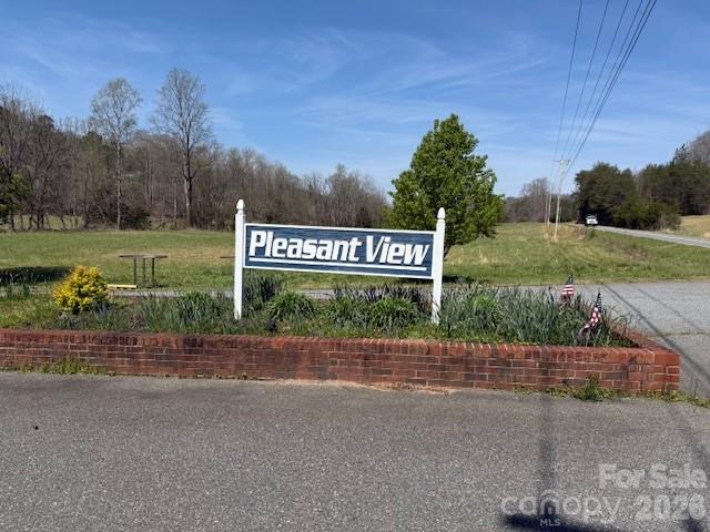 Nearly 6-acre lot located in the Pleasant View subdivision offering long-range mountain views and a quiet, private setting. Property features a level building site near the road with a gentle downward slope, ideal for maximizing views. Minimal undergrowth allows for easy access and walkability throughout the lot.
Situated at the end of Hope Drive, this parcel offers limited traffic and added privacy. Fiber optic cable has recently been installed in the subdivision, providing access to high-speed internet.
Excellent opportunity to build a primary residence or mountain getaway. One hour away from Charlotte and Asheville NC and Greenville SC. Less than 30 minutes to the Tryon International Equestrian Center.
Schedule your showing today.
