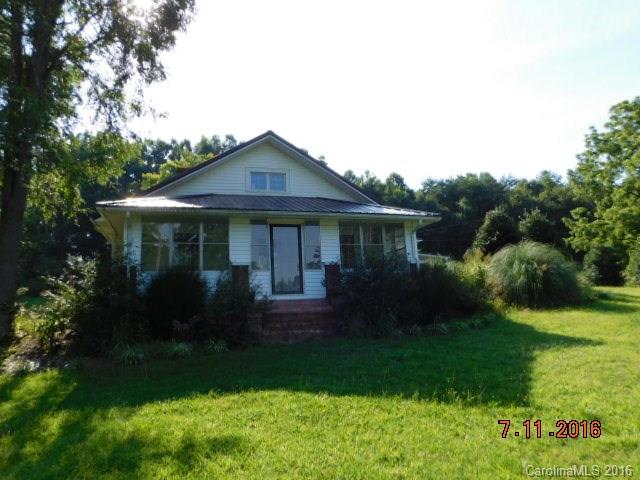 1.5 story home sits on more than half an acre lot features 2 bedrooms, 2 bathrooms, kitchen, living room, dining room, and bonus upstairs. Features include fireplace, ample cabinet spaces, kitchen island, and some wood floors. Home has porch, patio and 1 car detached garage. Another detached bonus room w/o HVAC. 690 sqft. Prior offer terminated due to inspections see attachments for radon and termite report. HVAC needs replaced too