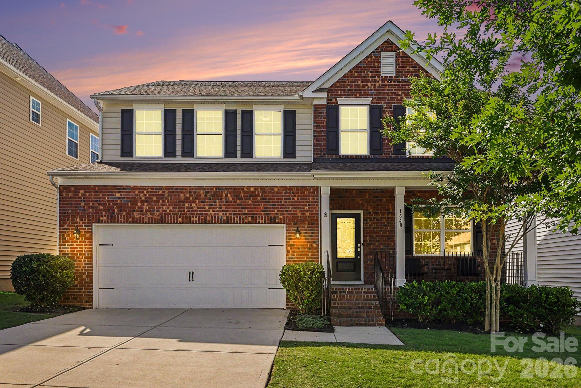 Discover this beautifully updated 4-bedroom, 2.5-bath home in the amenity-rich neighborhood of Waterside at the Catawba. Enter into a welcoming foyer leading to a formal office with French doors, perfect for remote work. The formal dining room seamlessly connects to an open-concept living area, highlighted by a cozy gas fireplace. The chef's kitchen boasts stainless steel appliances, including a new microwave and gas range, custom cabinetry, granite countertops, and a spacious walk-in pantry. Upstairs, you'll find three spacious secondary bedrooms with fantastic storage solutions, a full bath with a tub/shower combo and dual sink vanity and a versatile loft area ideal for movie nights. The conveniently located laundry room adds to the home's functionality. The primary suite is a true retreat, offering an expansive layout, an en suite bath with a soaking tub, stand-up shower, dual vanities, and a massive walk-in closet. Outdoor entertaining is a breeze with an oversized covered front porch and back deck overlooking a fully fenced, wooded backyard, complete with a separate fenced dog run. Plus, enjoy the cost savings and environmental benefits of solar panels. Enjoy access to fantastic amenities, including a clubhouse, sparkling pool, and tennis courts, all while living just steps away from the expansive Banks Athletic Park, offering the perfect blend of comfort and active outdoor living.  New carpet, fresh paint, designer lighting and so much more…schedule your showing today!
