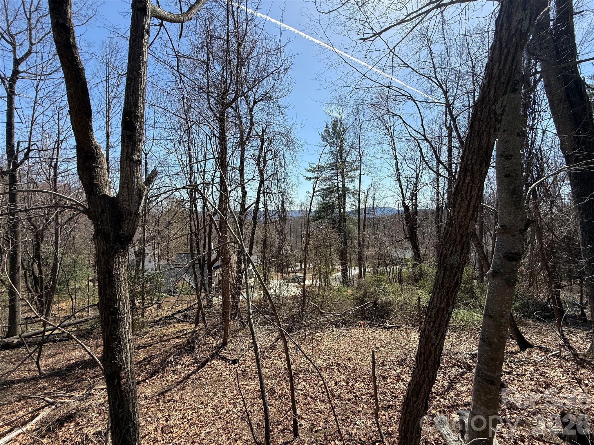 Tucked away in Laurel Park at the end of a cul-de-sac, this 2/3 acre sloping lot provides both a nice, flat home-site and long range mountain views. Flanked on the back by Laurel Park Hwy, the lot offers plenty of low-traffic road frontage as well; and offers easy access to Hendersonville, all from the serene privacy of Laurel Park. Utilities conveniently located at the front of the lot, helping drive down costs to build your dream home on this 0.62 acre plot. Laurel Park real estate does not come available often, so don't miss your chance to pick up a parcel in one of Hendersonville's most sought after communities.
