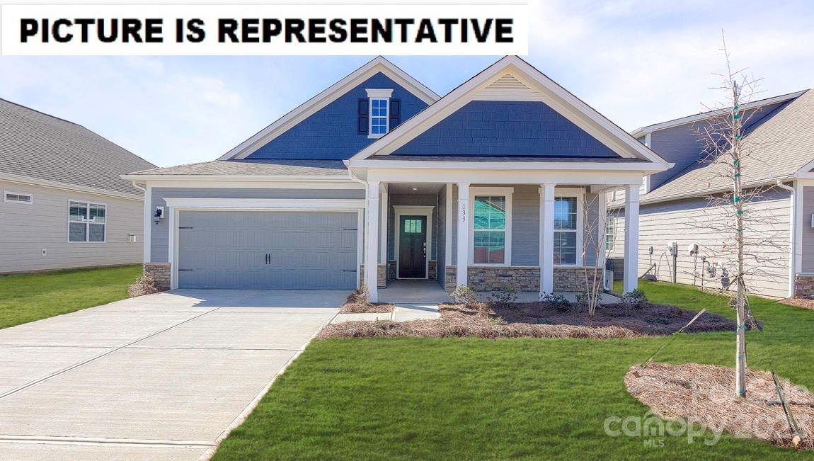 The popular Bristol plan features wide entry hallway with wainscoting, drop zone area, 9 ft ceilings and crown molding throughout home.  The living room with gas fireplace is open to the spacious kitchen and adjoins the dining area.  Primary bedroom is large and features double raised height vanities with quartz counters, walk in tiled shower with built in bench and expansive closet.  Features of this home also include Rev Wood flooring in living areas, halls, dining and kitchen.  Tile in laundry and baths, quartz counters and large island in kitchen.  Gas range, microwave, dishwasher and garbage disposal are included.  Home also features on demand water heater, Hardie board siding, architectural shingles, gas fireplace and much more!  Come tour this beautiful community located near downtown Troutman, Lake Norman State Park and all the shopping and dining that Mooresville offers!