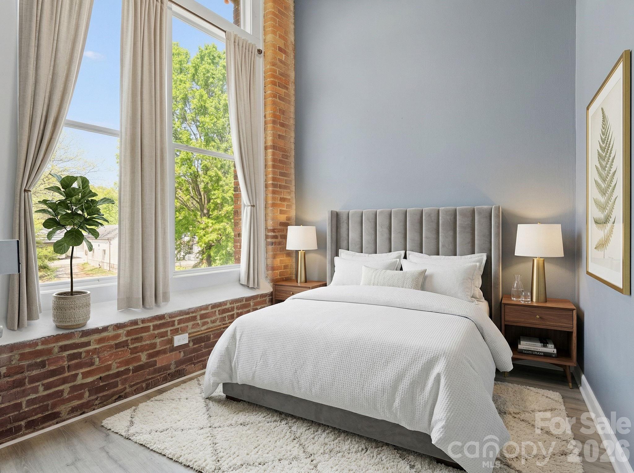 Thia ia  MUST see property in the Historic Hoskins Mill area loft community. You will love the high ceilings and exposed brick in each of the rooms. This condo displays lots of modern industrial charm that makes it quite cozy. In addition, there is plenty of natural light coming in through the large windows in the living area.