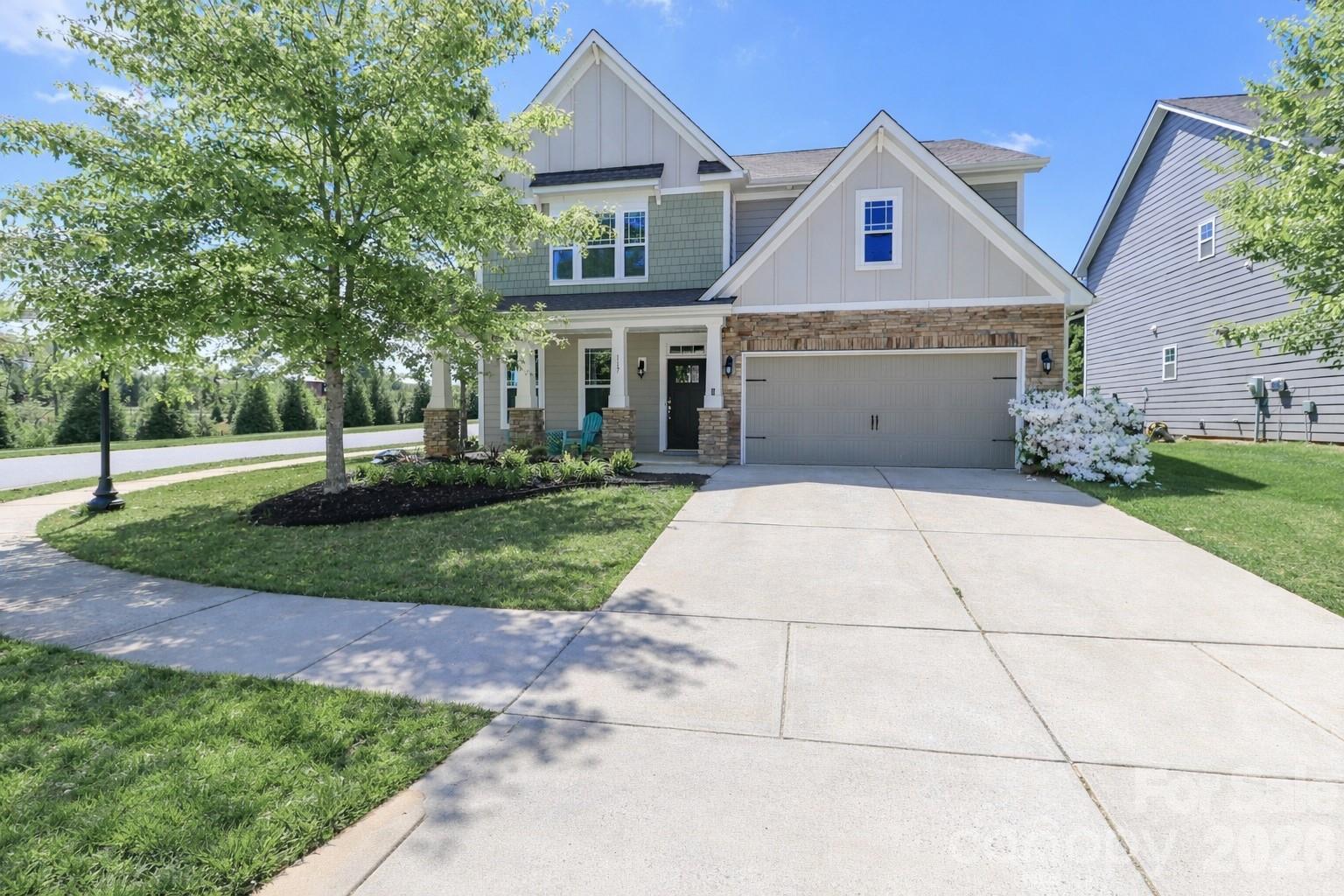 Seller offering $1,000 credit for backyard updates! Located in the highly sought-after lakefront community of LakeWalk, this home offers access to Lake Norman via a convenient paddle sports and canoe launch. 

The community features lake access, a pool, pickleball courts, paved nature trails, a dog park, playground, and more. Situated on a desirable corner lot, this impressive home is filled with upgrades, including a gourmet kitchen with double ovens, a gas cooktop, stainless steel appliances, granite countertops, and 5-inch wide hardwood floors. The kitchen opens to an oversized great room with a cozy gas fireplace.

A spacious butler’s pantry leads to the formal dining room with elegant coffered ceilings. The main level also includes a first-floor guest suite, a full bath, and a convenient drop zone.

Upstairs, you’ll immediately notice the large second-story family room. The primary suite features a sitting area, an oversized closet, and a beautiful en-suite bath. Two additional bedrooms, another full bath, and a laundry room complete the upper level.