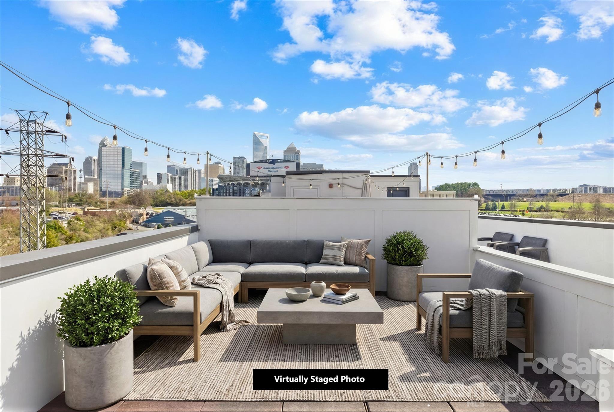 Welcome to this three-story condo in Charlotte’s rapidly transforming Third Ward, just steps from the highly anticipated Iron District redevelopment, bringing new restaurants, retail, offices, and entertainment to the neighborhood. Enjoy rooftop views of the skyline, Bank of America Stadium, and the future Iron District. Buy before appreciation makes it hard to find a unit this convenient! Inside you’ll find engineered hardwood floors, stainless steel appliances, abundant natural light, and a striking spiral staircase connecting you to the rooftop. Convenient laundry access located within a closet in your primary suite. The private rooftop terrace offers a rare outdoor retreat in the city—perfect for entertaining or relaxing while enjoying skyline and stadium-area views. Additional highlights include a private keyed entrance and gated parking for added convenience and security. Located within walking distance to Bank of America Stadium, Truist Field, Irwin Creek Greenway, Uptown, and South End, this condo offers incredible access to Charlotte’s best dining, entertainment, and outdoor spaces. A rare opportunity to own in one of the city’s fastest-growing areas!