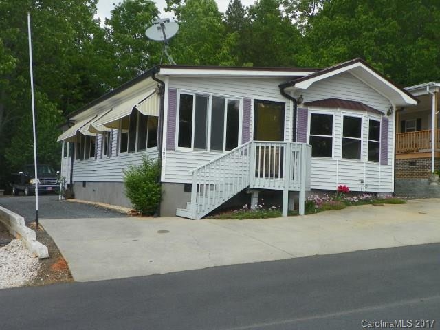 Nice Modular with lake view, covered back porch with ceiling fan and shades, private. Awnings over most windows, Metal roof put on 2016, New  Granite counter tops in Kitchen.
new floor covering in LR/Kit/DR, BR, New (2015) kitchen appliances, (SS), self closing cabinets, solid surface stove. New Hot water heater (2015), HP/CA replaced 2013).Interior painted 2015, Wired 10x10 storage bldg. Bath room- new shower, toilet,  flooring, vanity, and medicine cab. Lake View from front and back of home.