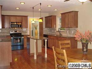 BACK ON THE MARKET. Taken off the market for a few months. Totally Remodeled..a gem in the finding. Outside of the house is being painted  week of Feb. 22nd. Large kitchen: granite countertops, subway style tumblestone backsplash, center island. All 3 baths beautifully remodeled. Large Bonus/recreation room or can be converted to 4th BR.Refinished hardwood floors,new windows, recent heat and air systems, great workshop/or art studio in back yard with electric, private yard. New landscaping.