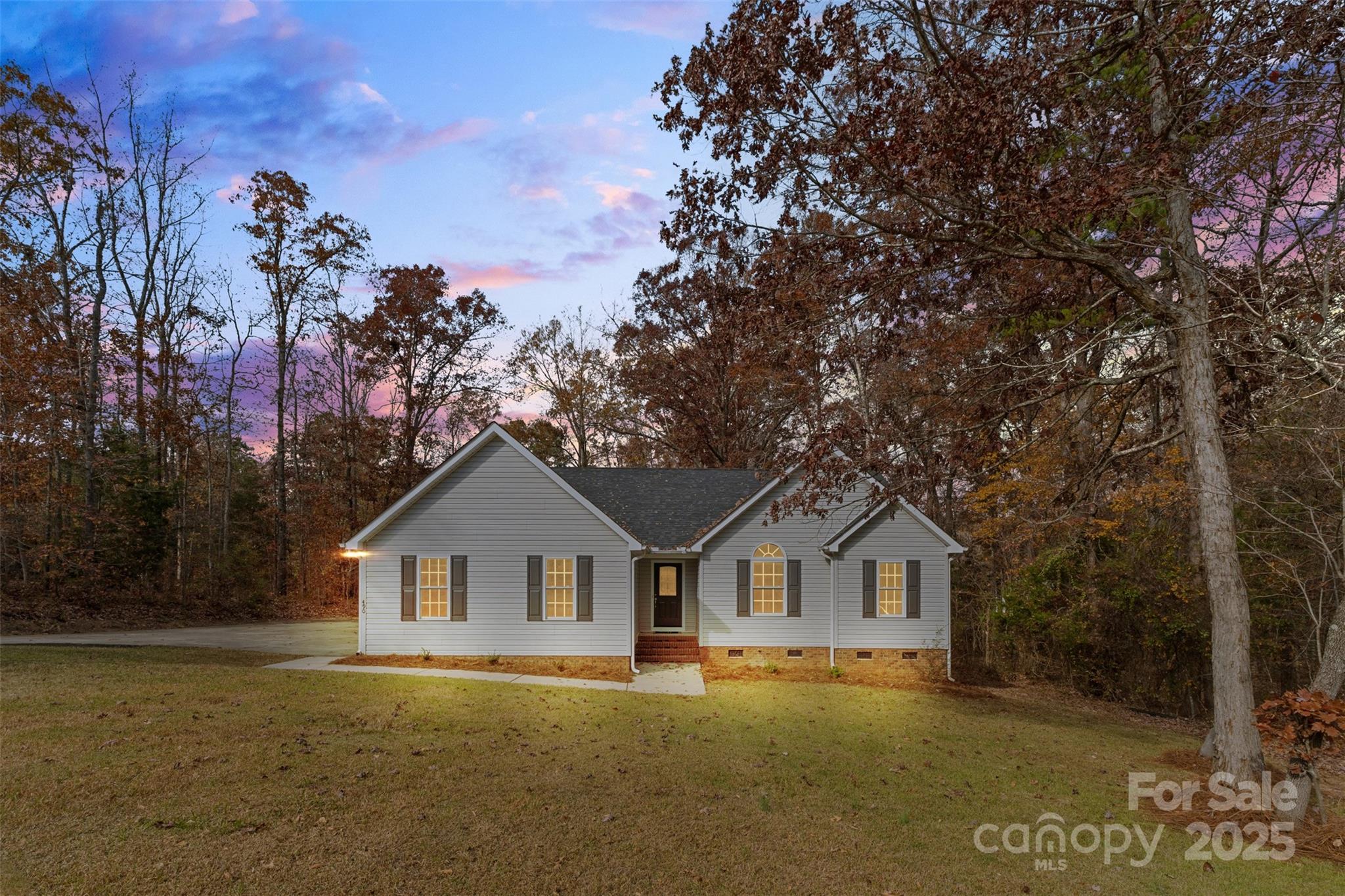 Built in 2008, this beautiful 3-bedroom, 2-bath ranch offers the ideal setup for single-story living. Step inside to find gleaming hardwood floors throughout the main living areas and an open, inviting layout filled with natural light. The spacious primary suite features hardwood floors, an architectural tray ceiling, walk-in closet, a large soaking tub, and a walk-in shower. The two secondary bedrooms are generous in size and include brand new plush carpet — the only carpet in the home.

Enjoy year-round indoor–outdoor living with a fully screened sunroom just off the back door, leading to a sturdy deck with new decking boards overlooking your 0.57-acre level, private, tree-lined lot. With no HOA, excellent privacy, and convenient access to town, this home offers comfort, functional usability, and a spectacular location. Fully prepped and ready for new owners to enjoy!