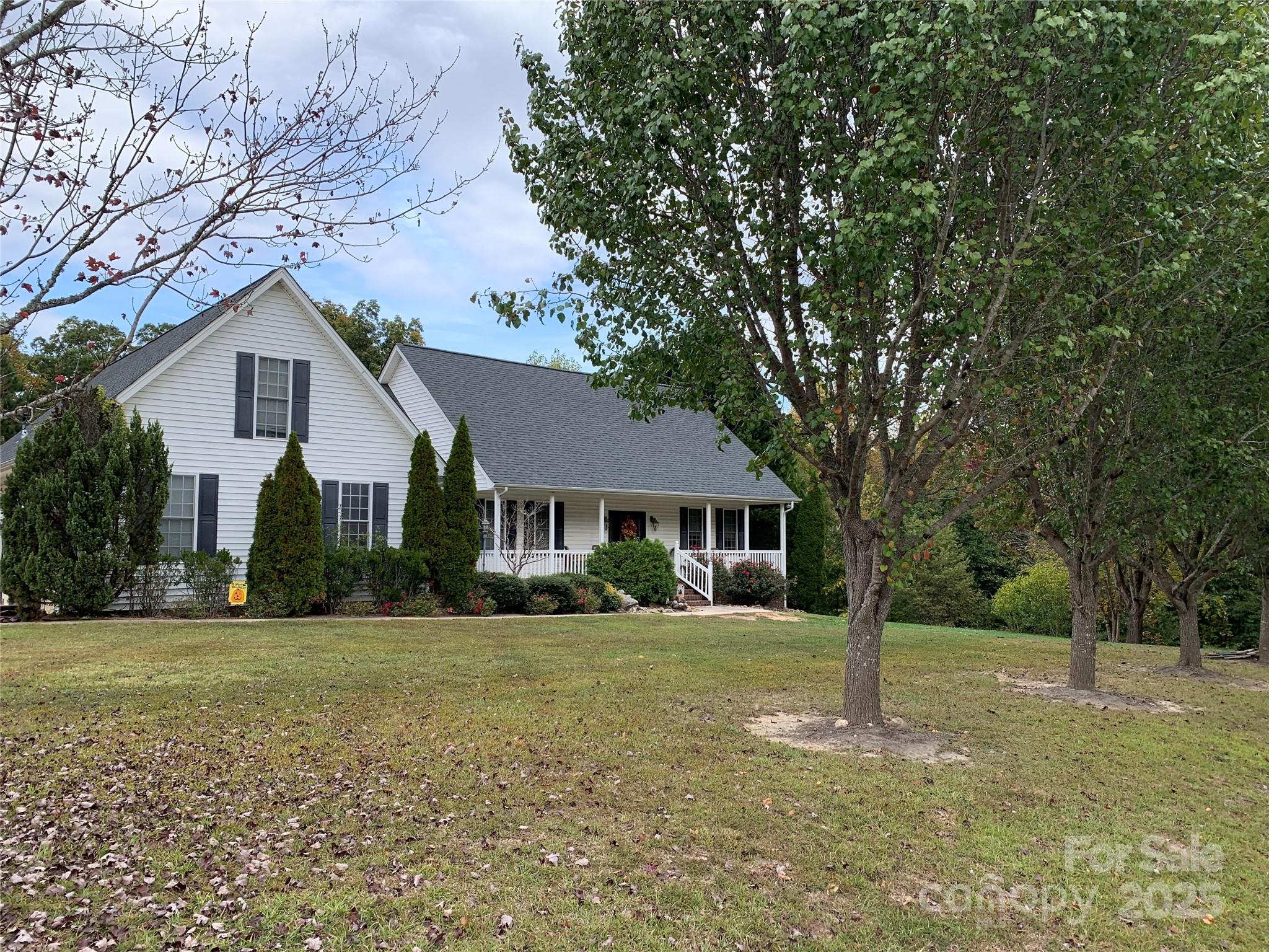 Welcome to this custom-built home in the desirable Hunters Place neighborhood. Located on a wooded lot this home features a rocking-chair front porch, custom built cabinetry, a walk-in pantry, bamboo flooring, closets in every room including two walk-ins in the primary bedroom, a walk-in attic, an oversized double garage with an attached utility room, an extra wide driveway, professional landscaping with mature trees and shrubs, a new roof, and many other custom features. The ultra-private backyard provides an abundance of entertainment space featuring 2 walk-ways from the driveway,  a large deck off the kitchen, a grilling deck, a patio and a gazebo. The gazebo has custom brick flooring and screens on all four sides. The backyard provides a feeling of being in the mountains. This home was designed by the owners and built to their specifications. There are many extra touches that one adds when building what they believe will be their forever home.