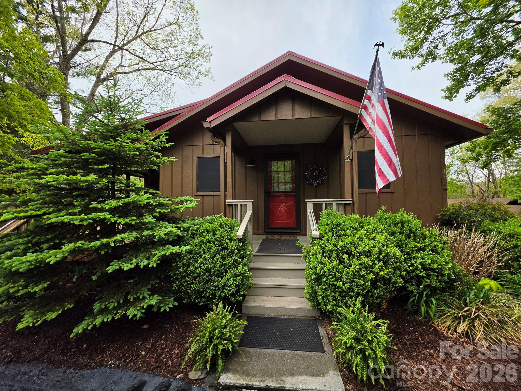 Simplify your life with this move-in-ready, year-round mountain home in Linville Land Harbor’s Mountain View neighborhood. The home offers 3 bedrooms, 2 bathrooms, a great room with a gas-log fireplace (not in use at this time) that can be converted to a wood-burning fireplace, and a sunroom for dining, an office, or a craft space. The kitchen features custom wood cabinetry, granite countertops, and stainless-steel appliances. Enjoy a covered, dog-friendly deck. The lower level includes a third bedroom or flex room (currently shown as a family room), a laundry/mudroom, and a half bath. The 2-car garage provides extra space and a separate golf cart parking area. Upgrades include a leaf-filter gutter system with a lifetime transferable warranty and Mitsubishi mini-split units. The exterior was painted with Rhino Shield, offering a transferable 25-year warranty, and the interior was recently painted. The circular driveway, along with a second driveway and garage, provides ample parking. There is space to store a travel trailer or smaller RV on the lower level of the lot. The garden is well-established. Linville Land Harbor offers amenities such as golf, a clubhouse, a game room, seasonal recreation, pickleball, tennis, trails, dog parks, a pool, trout fishing, and a lakeside beach. The POA covers water, sewer, trash, cable, and Wi-Fi. Experience exceptional mountain living.