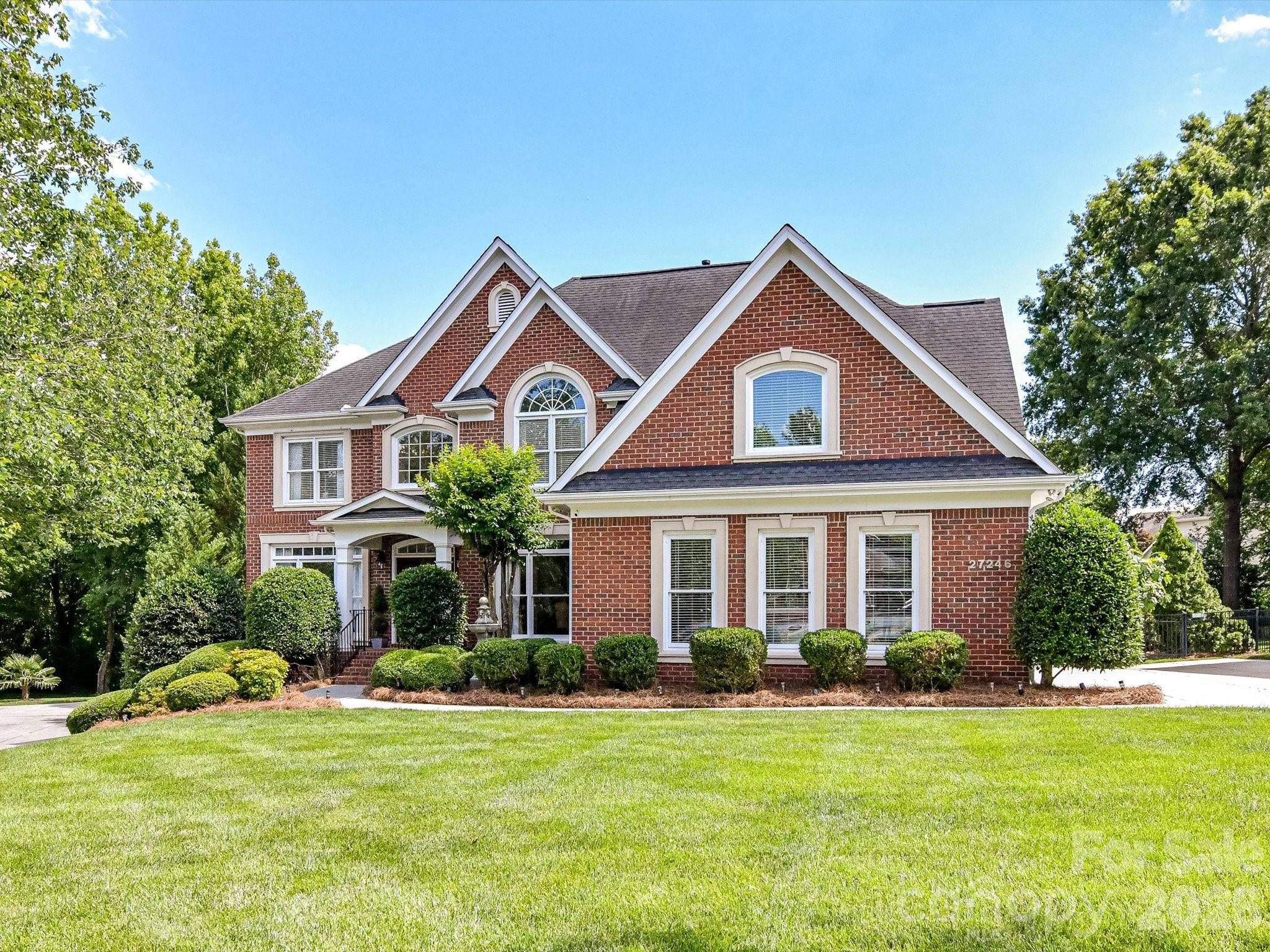 Stunning 3-story home nestled on a quiet cul-de-sac in sought-after Bridgehampton. This meticulously maintained 5 Bedroom home offers both elegance & comfort, featuring a perfectly designed floor plan. Soaring two-story great room is filled w/ natural sunlight/Spacious kitchen boasts ample cabinetry & generous counter space, ideal for everyday cooking or entertaining/Formal dining Rm. living Rm, Guest Bedroom & connected ensuite on the first level. The luxurious primary suite is on the second level & includes 3 walk-in closets! There are 3 additional generously sized bedrooms, each w/ connecting en-suites. The third level has a state-of-the-art movie theatre room and game room area, ideal for family movie nights! Step outside to a private oasis- huge, level, fully fenced, & beautifully landscaped yard. The expansive deck is perfect for entertaining! Resort-style amenities include a community pool w/slide, clubhouse, fitness room, tennis courts, pickleball, volleyball, walking trails & much more! Ideal location, conveniently located to Ballantyne & I-485 with low SC taxes!