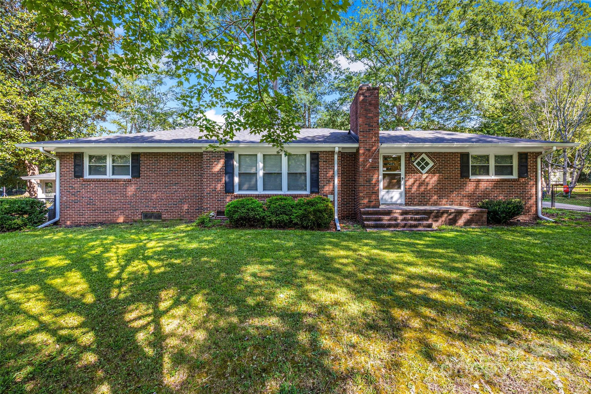 Located in Historic York, this classic brick ranch sits on a flat lot with no HOA in one of the area's beloved neighborhoods. Everyday living feels effortless in this home that blends timeless charm & modern convenience. Inside, you'll find fresh paint and 2 fireplaces (wood-burning in the family room & gas in the dining area) creating a warm, welcoming space. The roof, just 4 years old, adds lasting value & durability. The partially finished walk-out basement offers flexible space perfect for a home office, game room or storage. Enjoy the gracious backyard with a fenced yard, ideal for play, pets or weekend gatherings. The front yard irrigation system is in place; working & capable of expansion. The detached garage features electric & a mini-split system, ideal for projects or extra workspace. For added convenience, there’s also a 30-amp RV hookup, a dedicated sewer line & extra exterior storage. If you're looking for a home with character & versatility, this one checks the boxes!