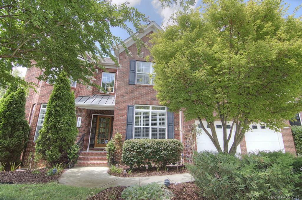 A Gardener's Delight in the Tega Cay Peninsula! Beautifully landscaped home w private terraced gardens, archways, custom cobblestone patio & walkways.  Spacious living areas, grand entry, extensive moldings, hardwood flooring, stunning two story great room, fabulous chef's kitchen, plantation shutters, main level master suite, fantastic second story bonus.  PLUS home has a part. finished basement w full kitchen, bed/bath, temp controlled wine room, gas generator. Walk to school, parks, lake!