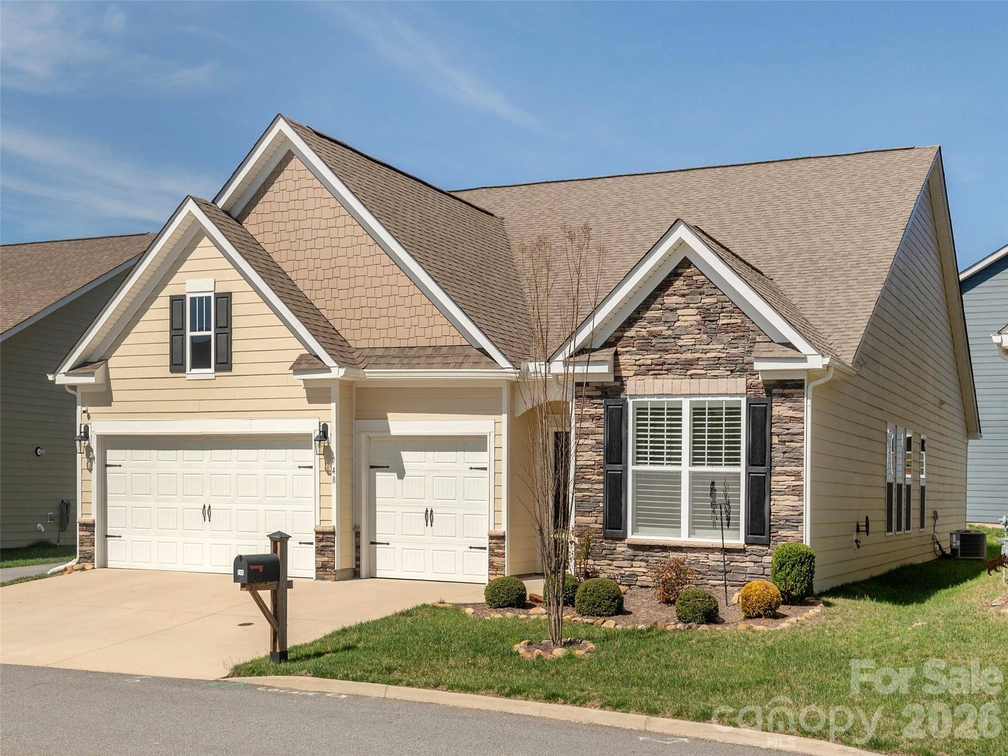 Nestled in the welcoming Orchards of Flat Rock, this Arts & Crafts–inspired home offers a sense of calm the moment you arrive. Thoughtfully crafted on one level, its 4-bedroom, 3-bath split floor plan creates a gentle balance of connection and privacy, making everyday living feel both effortless and deeply comforting.

The kitchen feels like the true gathering place of the home—its generous island, inviting dining area, and spacious walk-in pantry coming together in a way that naturally draws people in. In the living room, soft architectural details—a tray ceiling, custom built-ins, and a gas-vented fireplace—create a space that feels warm, grounded, and meant to be lingered in.

The primary suite offers a sense of retreat that feels almost restorative, with its tray ceiling, dual walk-in closets, and a bright bathroom featuring double vanities and an expansive walk-in shower. The laundry room adds thoughtful convenience with a built-in drying and storage unit, and the washer and dryer conveying.  The screened and covered back porch becomes a quiet sanctuary—perfect for slow mornings, peaceful evenings, and everything in between.

A three-car garage gives room for cars and a small workshop or extra storage area. All this with a close proximity to shopping, dining, the interstate, and air travel make daily life remarkably easy. Community amenities—including a clubhouse, outdoor pool, fitness center, and sidewalks—enhance the sense of belonging, creating a lifestyle that feels both elevated and warmly connected.
