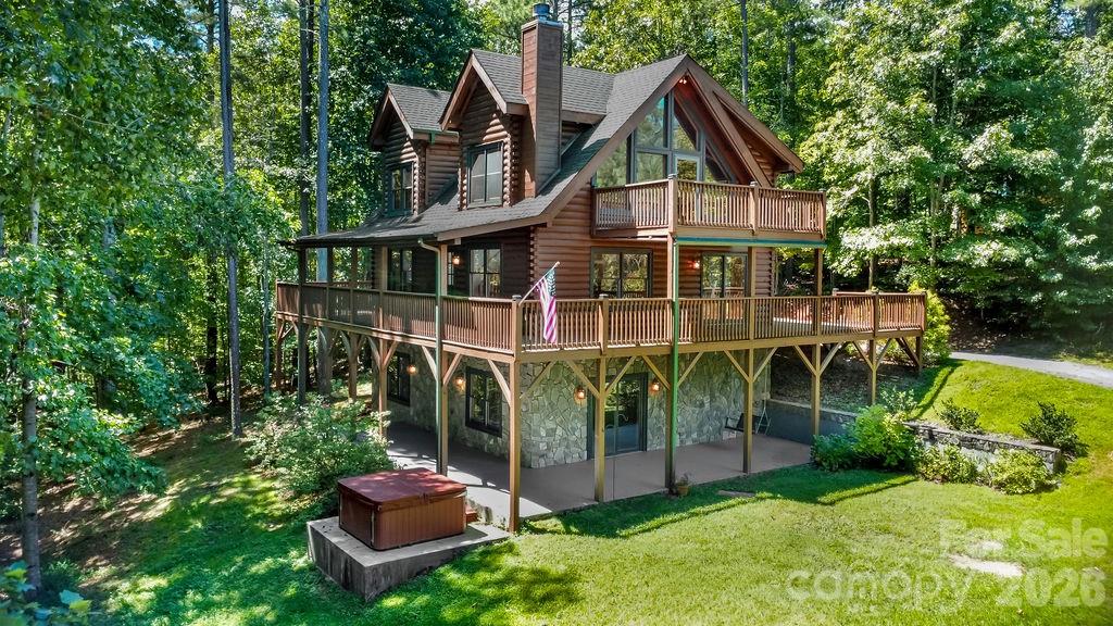 Located in the gated Hidden Lake community, this well-maintained 3-bedroom, 3-bath mountain chalet offers the perfect retreat for full-time living, a vacation getaway, or a short-term rental investment.
The great room features a dramatic two-story fireplace, while the chef’s kitchen is equipped with commercial-grade appliances and sleek prep surfaces. The home spans three walkout levels, each with a bedroom, full bath, and indoor/outdoor living space—perfect for entertaining, relaxing, or working remotely.
Enjoy zoned comfort with dual HVAC systems and a convenient three-story laundry chute. Recent updates include new exterior stain, deck maintenance, and a hot tub ready for you to enjoy.
Hidden Lake amenities include an outdoor pool, non-motorized boating, and hiking trails. Just beyond the community, discover endless outdoor recreation, a thriving food scene, and the rich culture of Western North Carolina.