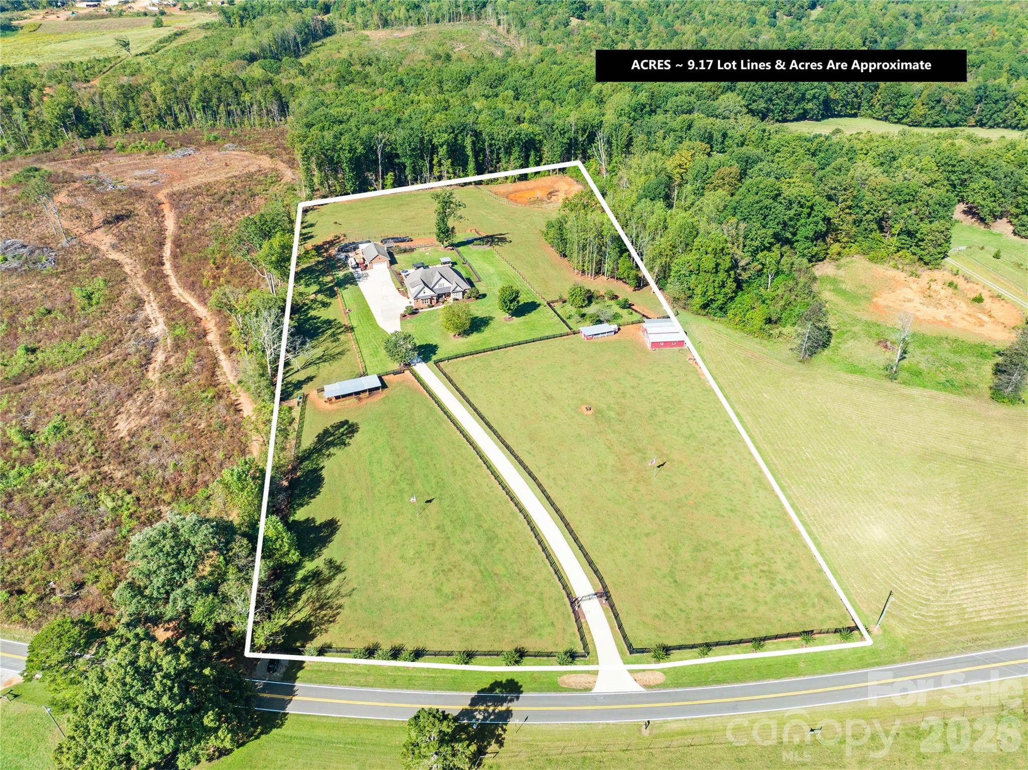 Turn-Key Farm Life has arrived in beautiful Catawba County — and this is the kind of property buyers spend years searching for. The moment you turn down Joe Johnson Road and catch your first glimpse of “The Farm Experience,” you’ll know you’ve found something special. From the iron double-gated entrance to the fully paved driveway lined with striking black fencing and active livestock, this property delivers the dream from the very first impression.

Perfectly situated on 9 breathtaking acres, this fully operational working farm blends comfort, function, and unforgettable beauty. The full brick home welcomes you with timeless curb appeal, inviting porches, mature landscaping, and quality craftsmanship throughout. Inside, you’ll find glowing hardwood floors, soaring ceilings, spacious living areas, and a layout designed for every stage of life. The primary suite and an additional bedroom are conveniently located on the main level, while upstairs offers additional bedrooms plus a bonus room perfect for guests, hobbies, or entertaining.

Out back is where the magic truly happens. Take in jaw-dropping sunset views from the brand-new illuminated deck overlooking the pool, rolling pastureland, and future pond site. The outdoor living spaces were built for gathering — featuring an expansive pool patio, outdoor kitchen, spa, and endless places to relax after a long day on the farm.

For the car enthusiast, hobbyist, or business owner, the detached full brick garage is a dream setup complete with HVAC, TV lounge area, and workspace flexibility. The barn is equally impressive, featuring its own HVAC system along with a fully equipped kitchen ideal for canning, food prep, and farm-to-table living.

The land itself is already producing and ready to go from day one. Enjoy a fully established orchard with fruit trees and bushes, thriving vegetable gardens, cattle, chicken coops, and room to continue growing your homestead vision. Water and power are strategically placed throughout the property, making daily farm operations simple and efficient.

This is more than a home — it’s a fully established lifestyle property that is nearly impossible to recreate at this price point. Truly turnkey, fully functional, and ready for its next chapter.