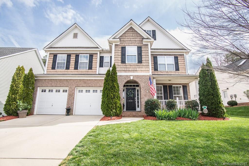 Gorgeous home in Millwood Plantation with covered front porch, two story foyer, hardwoods and tiled floors on main, granite counters, dual sided fireplace in kitchen and great room, stainless appliances, wainscoting, large master bedroom and master bathroom, trey ceiling in master, covered back porch with fan, fenced yard with stone paver walkway.