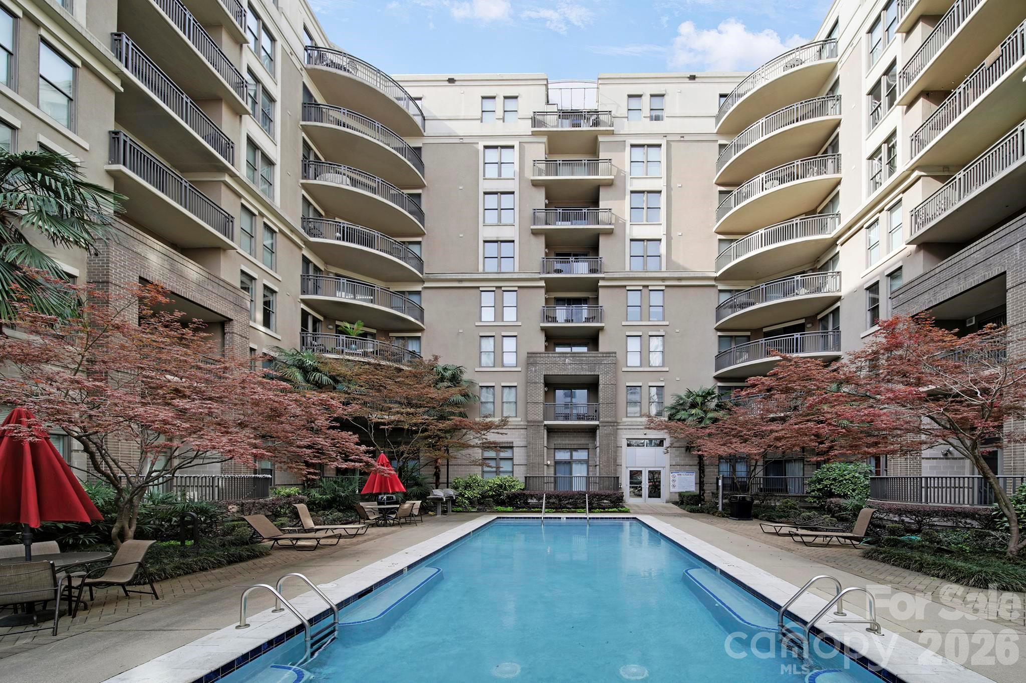 Welcome to Gateway Plaza and an exceptional top-floor residence offering the perfect blend of privacy, modern updates, and vibrant Uptown Charlotte living. This beautifully maintained 2-bedroom, 2 full bath condo features a thoughtfully designed layout with spacious bedrooms, large walk-in closets, and an in-unit laundry room for everyday convenience. The fully remodeled primary suite bath adds a touch of luxury, while updated finishes create a warm and inviting atmosphere throughout the home. Stylish fixtures throughout create a move-in-ready experience.

The kitchen is designed to impress with granite countertops, custom tile backsplash, stainless steel appliances including a gas range, and a functional layout that opens seamlessly into the living and dining areas, ideal for entertaining or relaxing at home. Step outside to your private patio overlooking the community pool, complete with your own gas grill, an uncommon and highly desirable feature that creates a true indoor-outdoor living experience.

As the new owner, you'll enjoy secure building access and a gated parking deck with two exclusive parking spaces, a rare find in Uptown, along with other resort-style amenities including a pool, rooftop terrace with skyline views, clubhouse, fire pit, and community gathering spaces.

Located just steps from Uptown’s best dining, nightlife, parks, and entertainment, along with easy access to I-77, I-85, and the light rail, this home delivers unmatched convenience and connectivity. Whether used as a primary residence, second home, or investment opportunity, this residence stands out with its top-floor location, unique outdoor features, and turnkey condition.

Don’t miss this opportunity to own one of Gateway Plaza’s most distinctive and desirable residences.