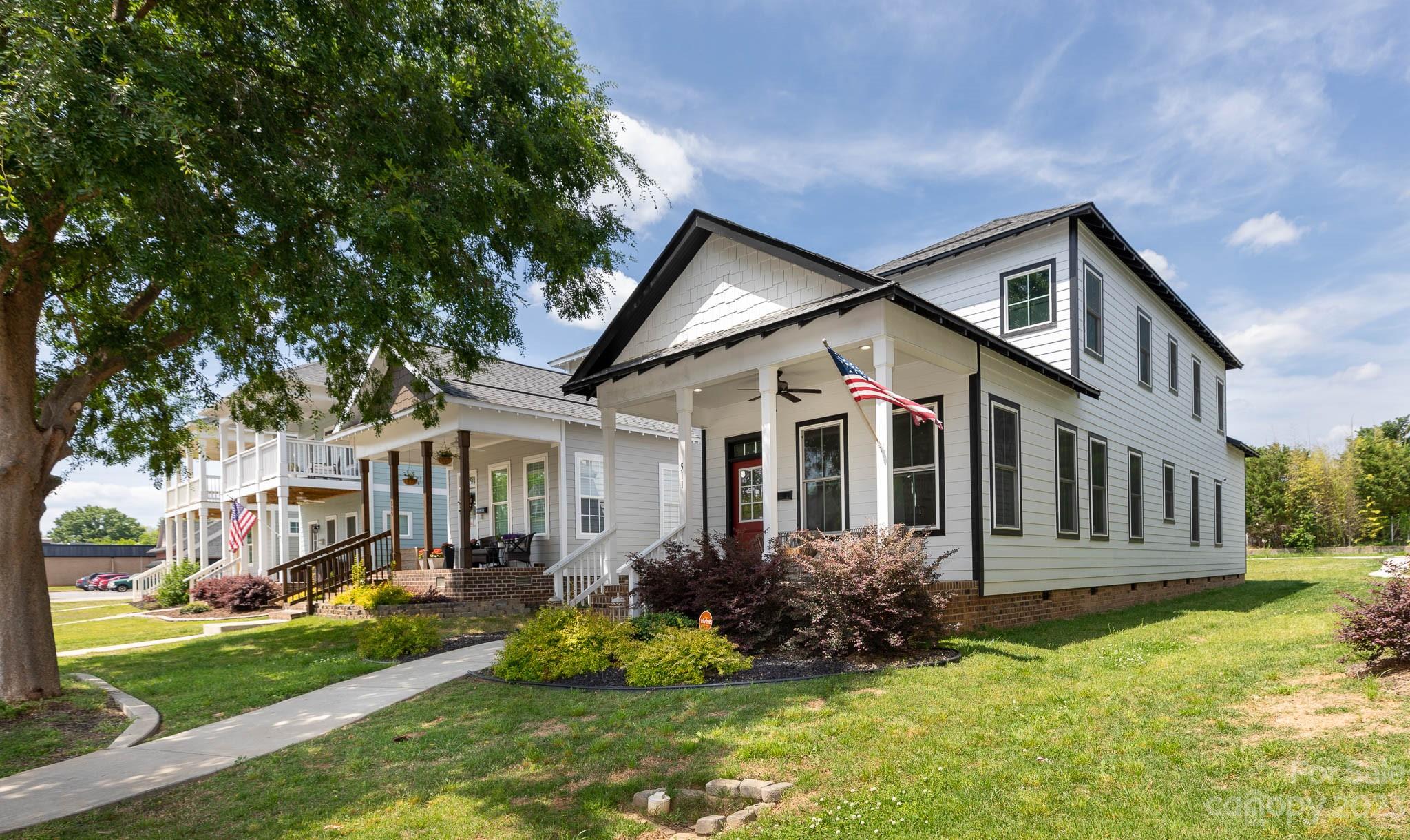 This 2020 home is spacious and modern with Charleston charm and an open floor plan. Throughout the main floor, you'll find 10-foot ceilings and elegant crown molding. The bright kitchen has white shaker cabinets, quartz countertops, a subway tile backsplash, an impressive pantry, stainless steel appliances, and modern hardware. The main floor primary bedroom has captivating tray ceilings. The gorgeous primary bath has a soaking tub and spa-like shower. The two upstairs bedrooms each have spacious closets and a large, shared bathroom with dual vanities.

Recent upgrades include custom Levolor® solar shades, floor-to-ceiling curtains, kitchen cabinet pull-out trash cans, luxury light fixtures in the kitchen and dining room, and a retractable gate on the side porch. Furniture is negotiable. The security system is available for transfer. HOA includes grass mowing. Walking distance to Fountain Park, Glencairn Garden, restaurants, and festivals. This home and location are a must-see!