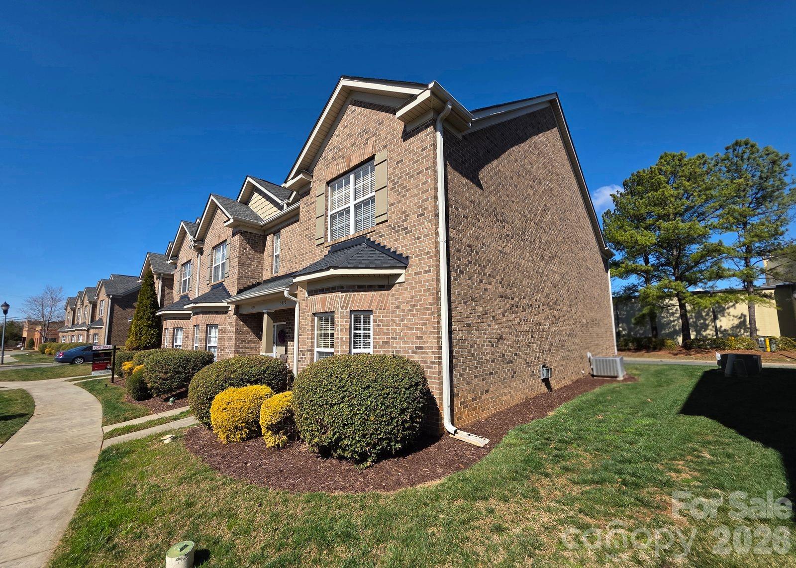 Your new townhome with timeless curb appeal and a well-designed floor plan offers comfortable, low-maintenance living in a convenient Charlotte location.

The exterior showcases classic brick construction, clean architectural lines, and established landscaping that frames the welcoming front entry. Inside, the main level features a spacious living area filled with natural light, creating an inviting environment for everyday living and entertaining. The open layout allows flexibility in furniture placement and easy flow between living, dining, and kitchen spaces.

The kitchen offers ample cabinetry and countertop workspace, making meal preparation efficient while remaining connected to the main living areas. Neutral finishes throughout provide a clean, move-in-ready feel and allow the next owner to easily personalize the space.

Upstairs, the primary suite serves as a comfortable retreat with generous closet space and a private en-suite bath. Additional bedrooms provide versatility for guests, home office space, hobbies, or other household needs. The secondary bath is conveniently positioned to serve the upper level.

An attached garage offers added convenience and storage capacity. Outdoor space provides an opportunity to enjoy fresh air while maintaining a manageable footprint.

This property is conveniently located near shopping, dining, and major roadways, offering practical connectivity while maintaining a residential setting.

Whether you are seeking a primary residence or an investment opportunity, this townhome presents a functional layout, classic exterior design, and a location that supports everyday convenience.

Schedule your private showing today.