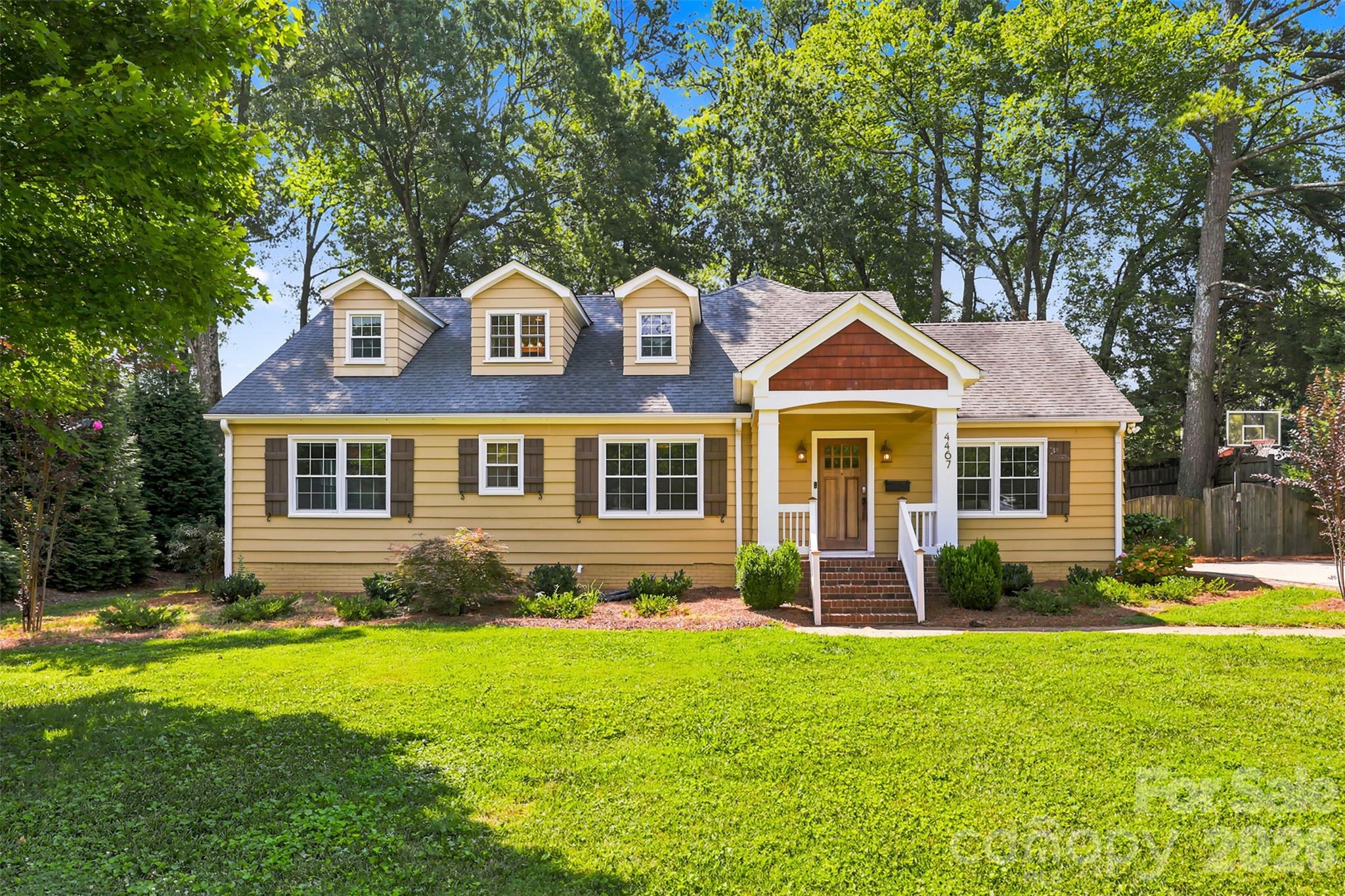 Bursting with timeless charm and character, yet also thoughtfully updated for modern living, this exceptional 5 bedroom/3.5 bath Cotswold residence offers more than 3,000 square feet of beautifully designed living space on a rare .439-acre corner lot. 

A welcoming covered front porch sets the tone for the warmth found within, where rich hardwood floors, custom built-ins and multiple wood-burning brick fireplaces create an atmosphere of classic elegance and comfort.
At the heart of the home, the renovated chef's kitchen blends style and function with a generous center island, farmhouse sink, gas range, integrated refrigerator, accent backsplash and abundant workspace, making it equally suited for everyday living and effortless entertaining. Just beyond, the expansive patio overlooks a fully fenced backyard, creating a private outdoor retreat complete with a spacious storage shed for tools, hobbies and recreational equipment.

The main-level primary is thoughtfully positioned for privacy, offering a peaceful escape from the home's gathering spaces. Two additional bedrooms, a full bath and an oversized laundry room complete the first floor with convenience and flexibility for a variety of lifestyles.

Upstairs, two spacious bedrooms share a well-appointed full bath, providing ideal accommodations for guests, growing households or dedicated office and bonus space. Set in one of Charlotte's most desirable neighborhoods, this beautifully maintained home offers the perfect balance of character, comfort and generous indoor-outdoor living in the heart of Cotswold!

2 of the bedrooms could be turned into a huge primary suite.