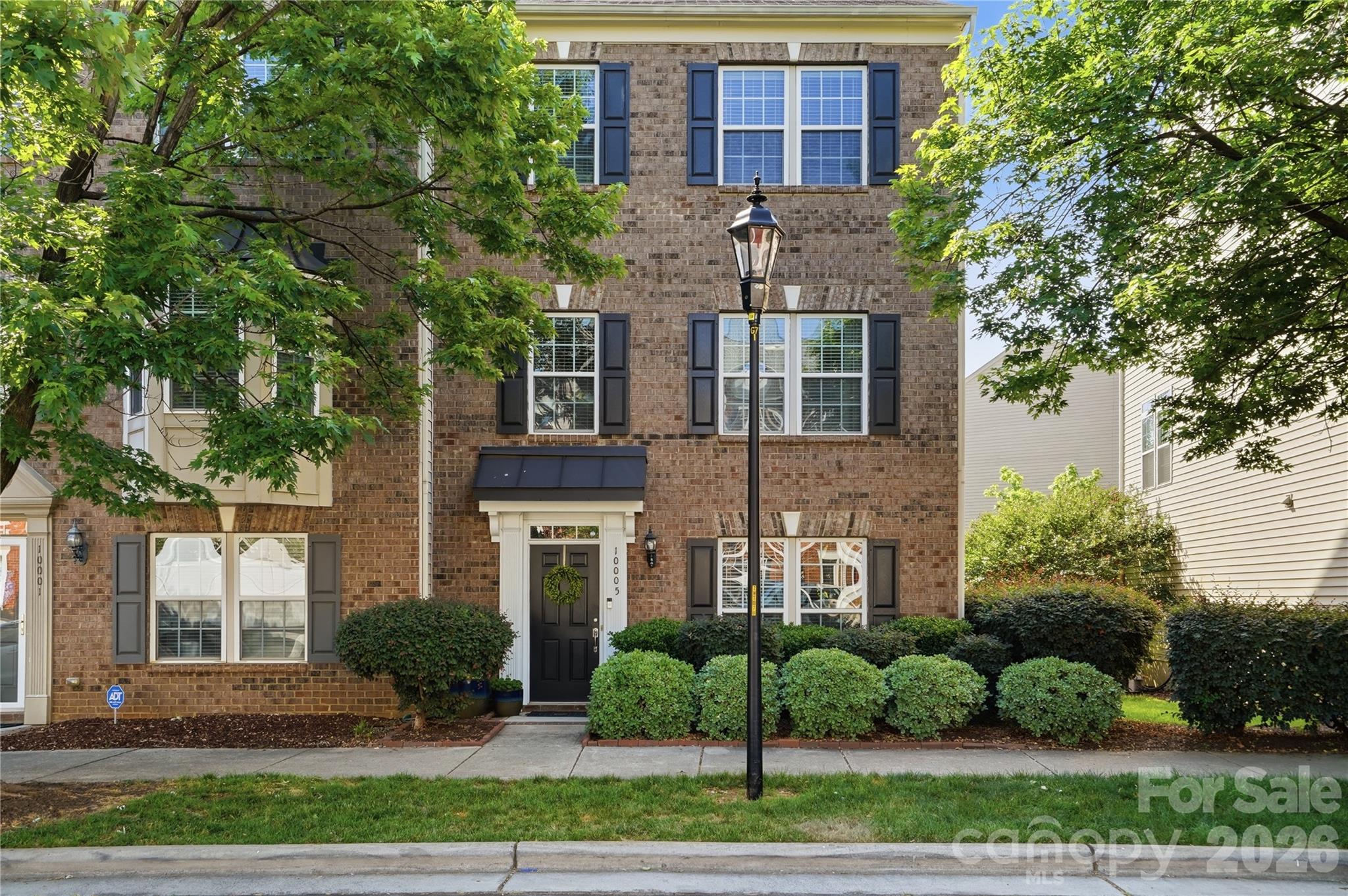 Welcome to Ayrsley Town Center and this beautifully updated end-unit townhouse offering 3 bedrooms, 2.5 baths, and a long list of new updates throughout.  With a prime walkable location within Ayrsley Town Center, you are just steps away from all the shops and restaurants, this home truly has it all. The main living areas shine with newer luxury vinyl plank flooring across the first two floors, giving the home a fresh, modern feel from the moment you walk in.  The large kitchen offers generous counter space and room to cook, making it a dream for anyone who likes to entertain. The flexible second floor bedroom features custom sliding barn doors and easily doubles as a home office or guest suite.  The spacious primary bath has been recently renovated to include a newer shower, floor to ceiling tile and newer flooring.  Step outside to your large, elevated deck – perfect for relaxing, grilling, or hosting guests. Major systems have all been replaced, including a newer(2024) top-of-the-line HVAC, furnace and water heater(2024), giving you total peace of mind for years to come.  The two-car garage and two-car driveway round out this home with ample parking and storage.  All of this just a short walk to your private community pool and everything the neighborhood has to offer.