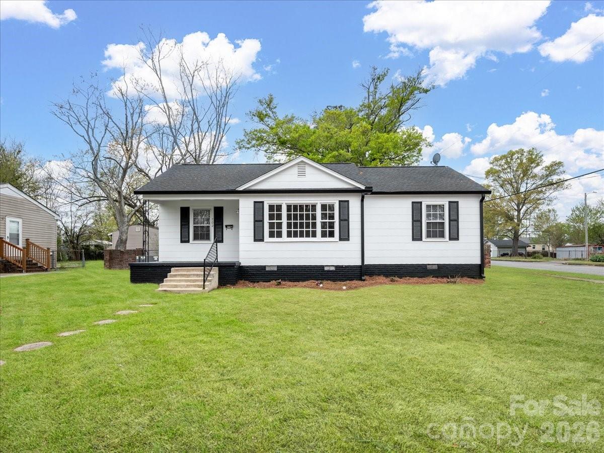 Lovely ranch home on a nice level corner lot with parking in the rear yard. Interior and exterior freshly painted. The Roof is 2026, and the gas pack is about 10 years old. The water heater replaced in  2026.  The kitchen opens to the dining area, with a nice backsplash, a refrigerator, and hardwood flooring throughout the home. Your laundry area is on the rear porch—a nice front porch to enjoy the morning and your coffee. Call for your showing now!