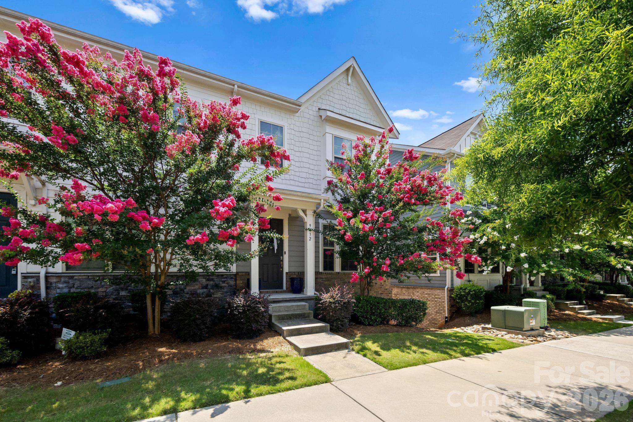 Welcome to effortless living in this beautifully appointed end-unit townhome, where abundant natural light, thoughtful design, and peaceful views come together. The open-concept main level is filled with sunshine from extra windows and features a chef-inspired kitchen with granite countertops, stainless steel appliances, a gas range, oversized island, and walk-in pantry, seamlessly flowing into the spacious living and dining areas.

Offering three generously sized bedroom suites, each with its own full bath, this home provides exceptional flexibility for guests, roommates, or a private home office. Step outside onto the balcony to enjoy tranquil views of the pond and mature trees, creating the perfect spot to unwind with your morning coffee or evening drink.

Complete with a two-car garage and ideally located just minutes from shopping, dining, major highways, and the light rail, this home combines low-maintenance living with comfort, convenience, and a setting that's hard to find.