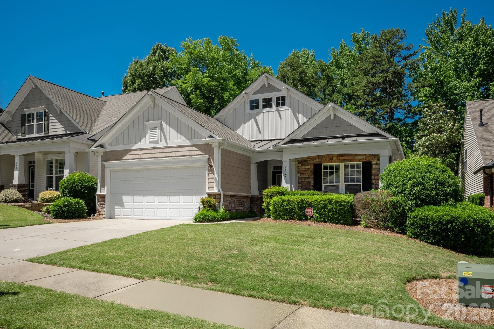 Rare opportunity in desirable Lawson to own a ranch home on a quiet cul-de-sac with lawn maintenance included! This move-in ready home is ideally situated on a private .20-acre lot backing to wooded views, offering both comfort and low-maintenance living.

Enjoy your morning coffee in the enclosed sunroom or entertain guests on the spacious back deck overlooking the peaceful backyard setting.

The open-concept floor plan flows seamlessly from the kitchen into the inviting family room featuring a cozy gas fireplace, creating an ideal layout for both everyday living and entertaining. The generously sized primary suite offers a beautifully updated walk-in shower, double vanity with new lighting, and a spacious walk-in closet.

This flexible floor plan also includes a generously sized laundry room, secondary bedroom, full bath with updated fixtures, and additional living space perfect for a home office, gym, or playroom, along with a sun-filled dining area.

Residents of Lawson enjoy exceptional community amenities including walking trails, tennis courts, pickleball, outdoor pool, fitness center, and clubhouse. Conveniently located near charming downtown Waxhaw with easy access to shopping, dining, recreation, and top-rated Union County schools. Complete with a 2-car garage.