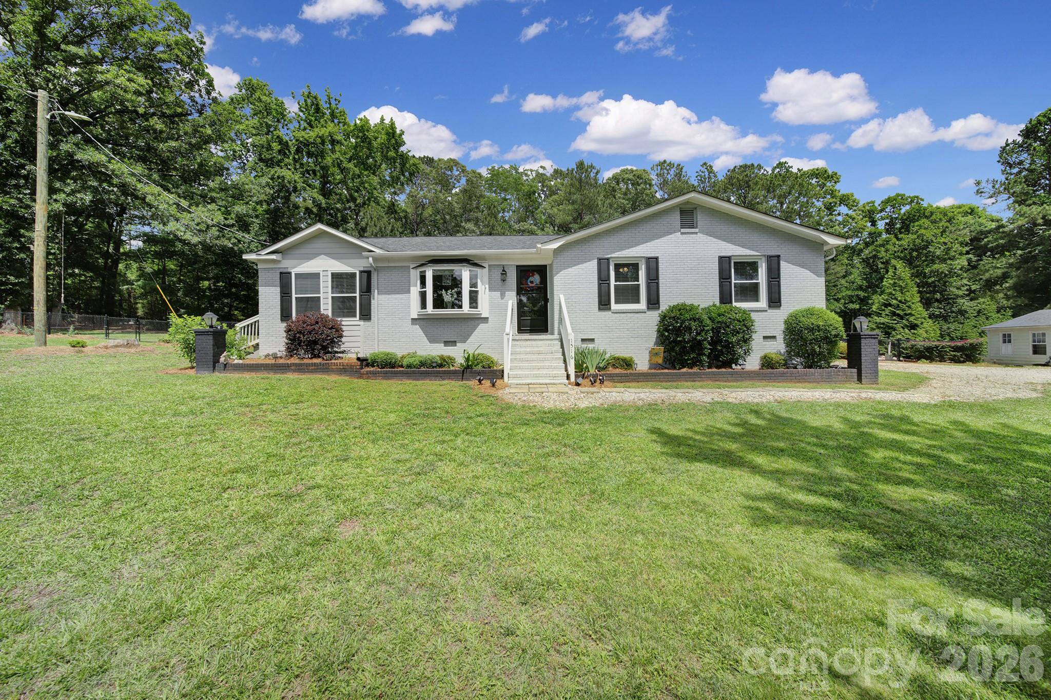 Here's your slice of paradise with room to breathe on 2.58 acres just off Lowrys Highway. This property includes a detached one car garage, a 10'x20' shed, an in-ground pool, a hot tub, a screened-in porch overlooking the pool and concrete patio, a fenced yard, and plenty of space to entertain or spread out and enjoy the quiet country life. Inside, the kitchen features an island, dark granite countertops, and a tile backsplash that contrasts with the white cabinets. Be sure to look behind the barn door on the wood accent wall to find a spacious walk-in pantry leading to the laundry room. Notice how the open floor plan is very functional, wasting no space. Several rooms have been freshly painted, the attic was sprayed with insulation, and a new roof and windows were installed in 2021. With this country setting and a backyard that feels like your own private getaway, this property makes it easy to slow down and stay awhile.