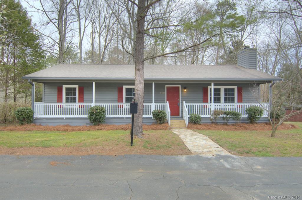 Nicely updated home in the heart of the Tega Cay Peninsula.  Four bedrooms, three full baths, updated kitchen and baths.  Home offers large living spaces, pretty stone fireplace, close to trails, parks, lake and golf.  New laminate flooring throughout, recently painted, new kitchen appliances.  Spacious wrap around covered decks, rare flat and wooded lot.  Tega Cay vacation lifestyle, Fort Mill Schools, new Tega Cay Elementary School.