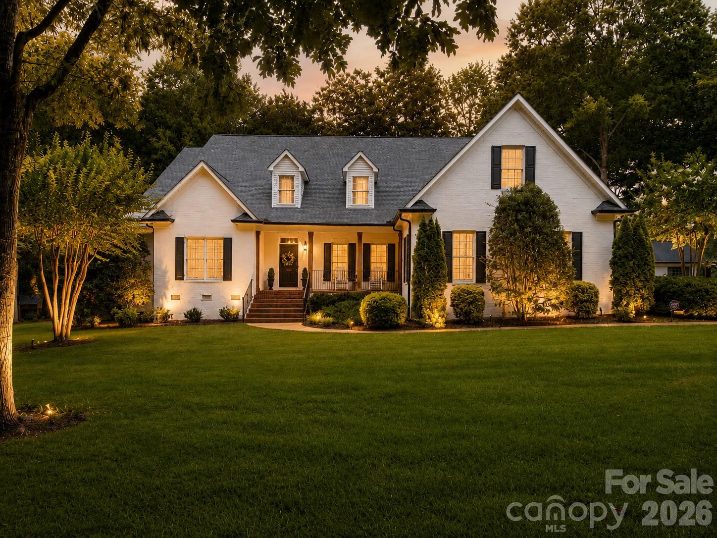 Rare Marvin opportunity on approximately 3.33 private acres, thoughtfully renovated, expanded, and updated for today’s luxury buyer. Offering approximately 5,500 square feet, 611 Pacer Lane features multiple flexible living areas, and a layout designed for everyday comfort, entertaining, work-from-home living, and extended-stay guests.
Extensive updates include fresh interior and exterior paint, updated lighting, ceiling fans, recessed lighting, smart thermostats, plantation shutters throughout much of the home, refreshed baths, and a beautifully reimagined main level. The kitchen was completely reconfigured and now features a large island, quartz countertops, farmhouse sink, subway tile backsplash, custom wood vent hood, Café gas range, built-in wall oven, built-in microwave, pot filler, beverage/wine refrigerator, expanded cabinetry, and custom shiplap detail. A former butler’s closet has been transformed into an open custom wet bar with quartz, tile backsplash, trim detail, and additional storage/display space.
The main level includes a spacious primary suite, guest bedroom, office/flex room, sunroom/TV room, formal dining with custom molding, and inviting living room with custom mantel. Upstairs, a significant expansion created a luxury second primary suite with two oversized walk-in closets and a spa-style bath with large double walk-in shower, glass enclosure, bench, stone shower flooring, and dual vanities. Additional upstairs spaces include a movie room, oversized bonus/playroom, and tremendous walk-in storage.
Outdoor living shines with a screened porch, custom wood ceiling, TV hookup, stamped concrete patio, updated exterior lighting, extensive landscaping, and a peaceful estate-like setting. Additional highlights include walk-in closets in every bedroom, whole-house generator, EV charger, large garage storage, shed with electricity, and room to imagine future outdoor enhancements. Sought-after Marvin location close to Waxhaw, Weddington, Ballantyne, Blakeney, shopping, dining, and commuter routes. Interior photos will be added by 7/13