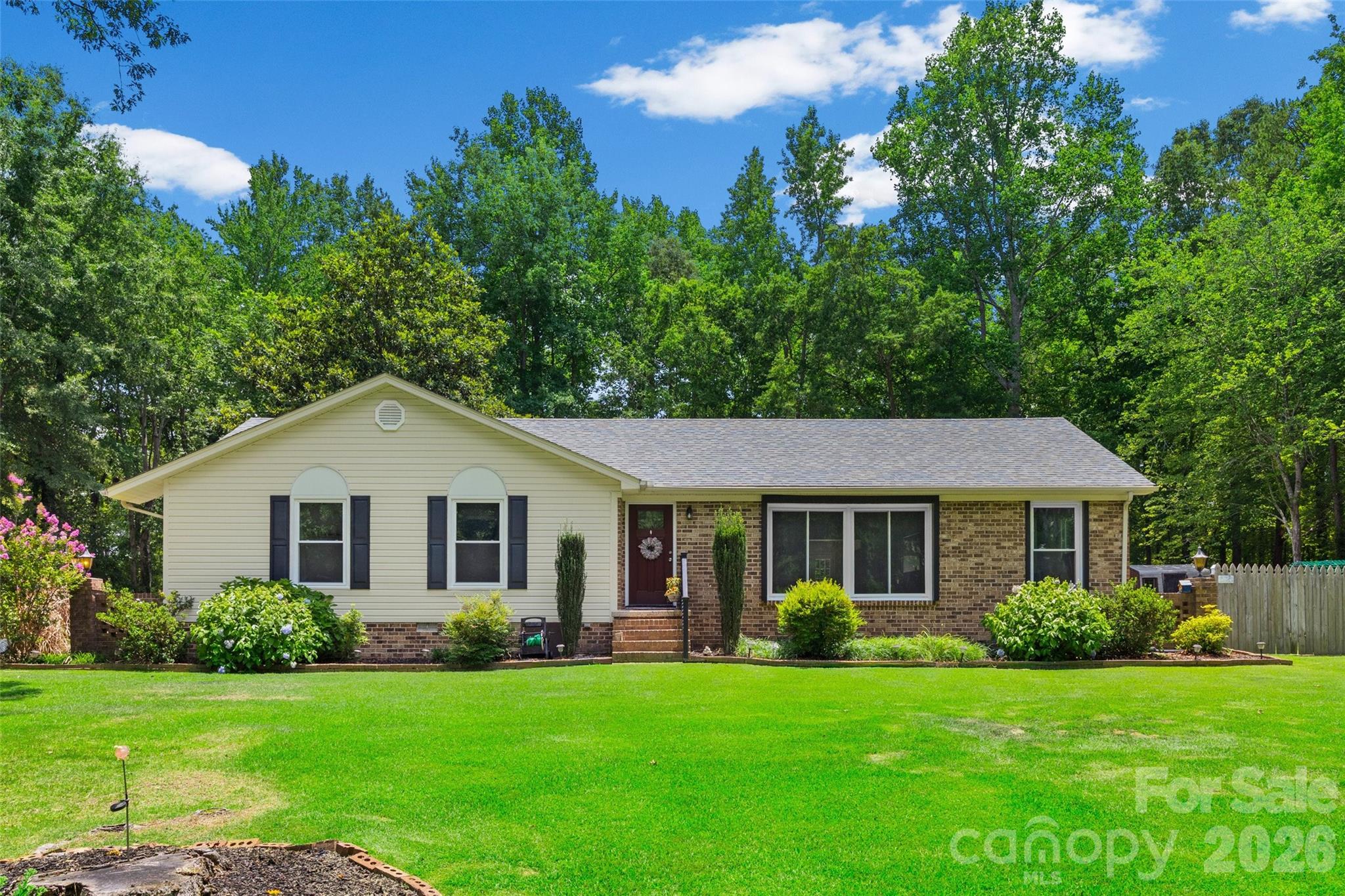 Welcome home to this beautifully updated ranch home nestled in the peaceful countryside!  Situated on nearly an acre of land, this spacious property offers the perfect blend of modern updates and country charm.  Inside you'll find 4 generously sized bedrooms, 2 1/2 updated bathrooms, and a flex room - perfect for a home office, playroom or home gym.  The updated kitchen includes stainless steel appliances with a large island, providing a great space to cook and entertain.  The open and inviting family room features a gas fireplace and is designed for comfortable everyday living. Tasteful updates throughout make this home truly move-in ready.  One of the best features of this home is the outdoor space.  The fenced-in backyard offers the perfect opportunity to enjoy gardening, outdoor activities or simply relaxing and enjoying the peaceful surroundings.  Ideally located on a quiet street you'll have the space and privacy you've been looking for while still enjoying the convenience of nearby amenities.  Book your showing today!