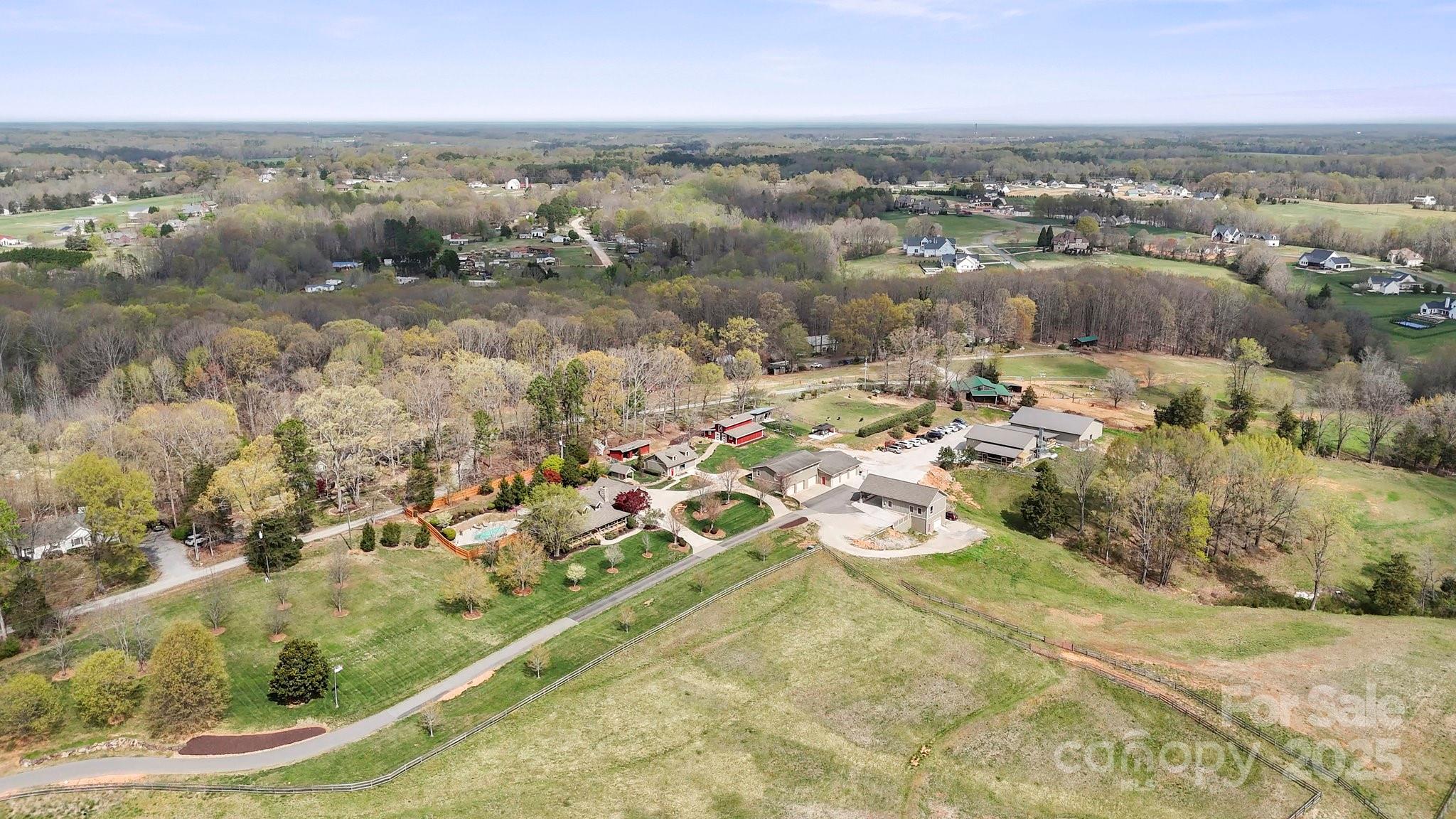 Two parcels totaling 22 acres (1620 London Road & 230 Hearthstone Ridge)
Nestled in the pristine North Carolina countryside, this extraordinary 22-acre estate offers a rare blend of elegance, purpose, and prosperity. At its heart stands a handcrafted Hearthstone log home, surrounded by tranquil koi ponds, a saltwater pool, a guest cottage, and an event-ready barn—ideal for retreats, weddings, or multi-generational living. More than a residence, it’s a legacy. Also on-site: a 5-star certified collision center with five national certifications—an active, income-producing business adding unique commercial value.

Whether expanding the business, creating a wedding venue, launching an equestrian facility, or developing a luxury retreat, the possibilities are vast. For those seeking a luxury lifestyle or a distinctive investment, this one-of-a-kind property offers the space to live, work, and thrive—all in one breathtaking sanctuary.
