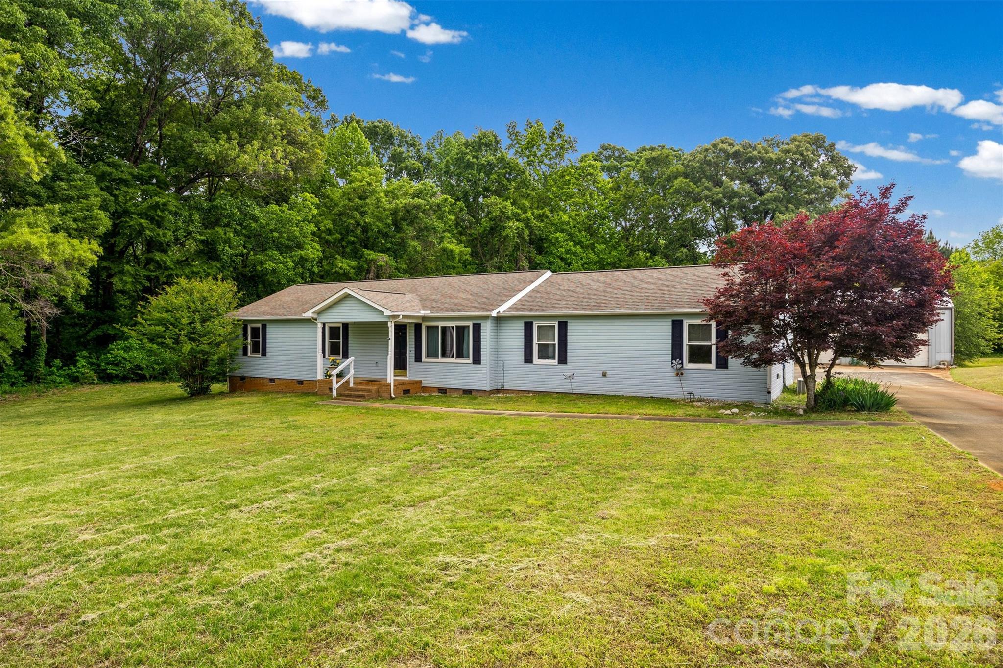 Welcome to 161 Shadow Lakes Drive in Clover—where space, flexibility, and opportunity come together on 3.5 flat, usable acres in the highly sought-after Clover School District.

This home offers 3 bedrooms and 2 full bathrooms, with both baths recently remodeled to include convenient walk-in showers, giving you a fresh, updated feel where it matters most. The primary suite features a large walk-in closet and an en suite. ,

The eat-in kitchen offers ample cabinetry and flows easily into the den, making it a practical layout for everyday living and gathering. The former garage has been finished into a bonus room, adding valuable flex space—perfect for a home office, playroom, or second living area.

Step outside and you’ll find where this property truly shines. The 3.5-acre level lot gives you room to spread out, create, and enjoy. Whether you’re dreaming of a garden, outdoor entertaining space, or simply enjoying the privacy, the possibilities are wide open.

For those who need space to work or store equipment, the property includes an impressive 1,800 sq ft workshop with electricity and water (half bathroom), along with RV/boat storage with power already in place—a rare find.

With no HOA, you have the freedom to use your property your way. The home is ready for your finishing touches, offering a great opportunity to add your personal style and build equity.

If you’ve been looking for space, functionality, and flexibility—this one is worth a look.