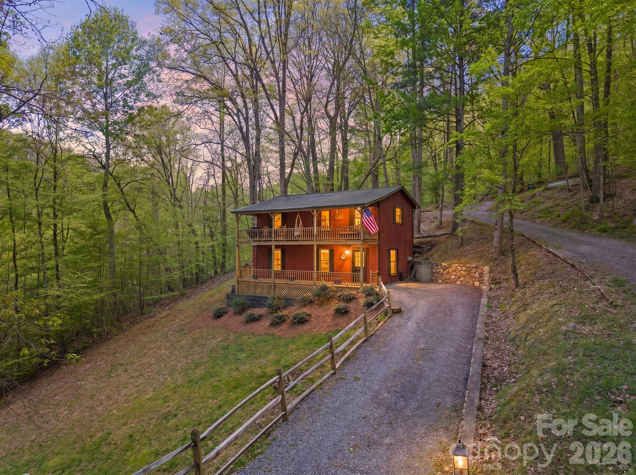 Nestled in the mountains, this beautifully maintained 2-bedroom, 2-bath home offers privacy and the perfect mountain retreat—ideal as a full-time residence, second home, or income-producing opportunity. Set on just under half an acre, the property features recently stained wood siding and a durable metal roof for added peace of mind. Being sold furnished, this move-in ready, each level offers its own living space and private ensuite, providing comfort and flexibility for families, guests, or rental potential. The upper level boasts vaulted ceilings, enhancing the open, airy feel. Enjoy two expansive decks, one on each level, perfect for morning coffee, relaxing with family, and taking in stunning mountain views. Tucked away for peace and seclusion, yet conveniently located just minutes from town, local shops, restaurants, and everyday amenities.