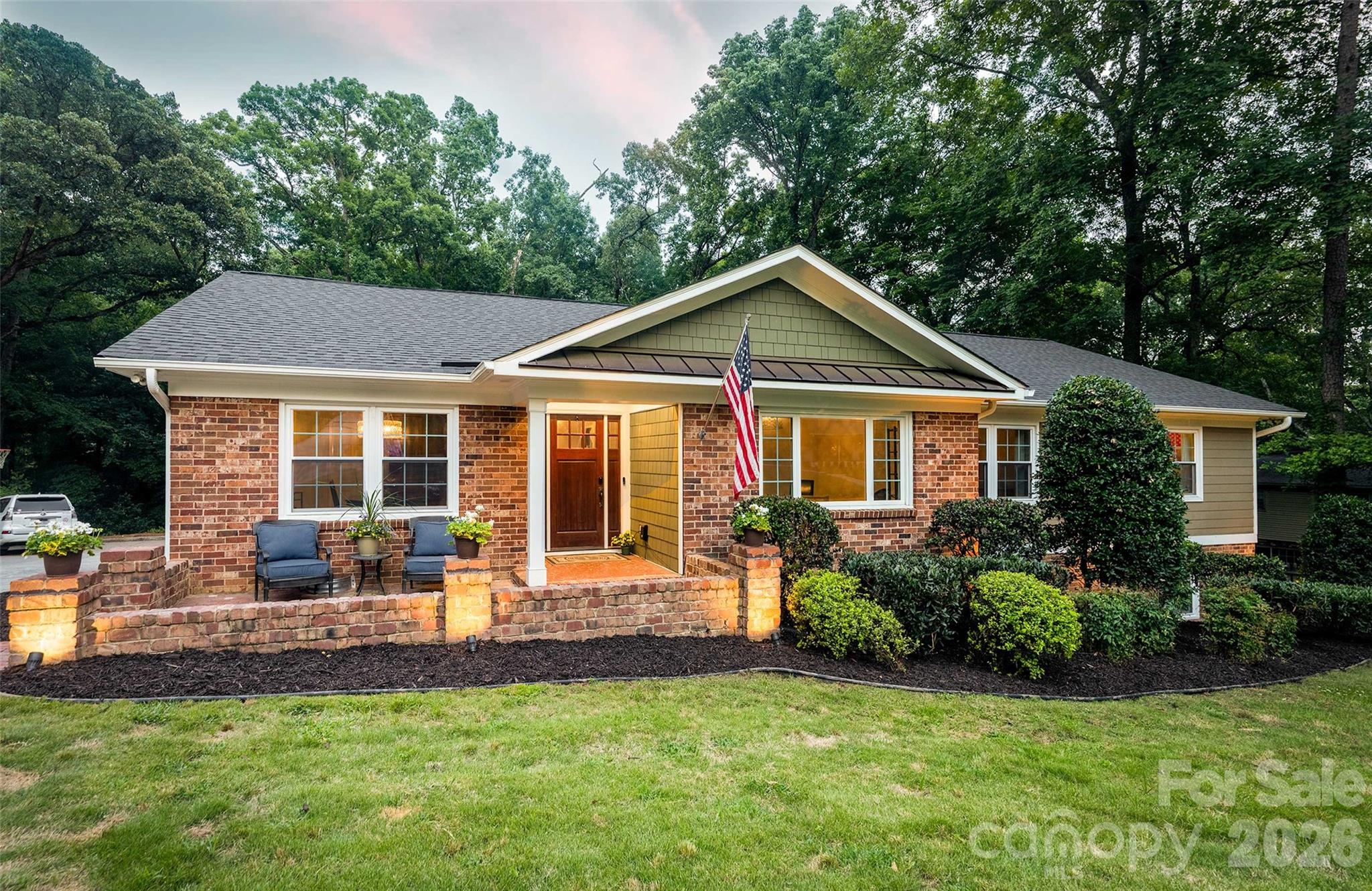 Stylish main-level living meets exceptional space in this updated classic ranch with basement in sought---after Robinson Woods—just 15 minutes to Uptown, 9m to SouthPark, close to top private schools including walkable to PDS (neighborhood has gated access)..  The welcoming foyer opens to a French doored office/living room, spacious dining room, and living areas that overlook the lush, verdant yard. The stunning kitchen features a statement island, beverage fridge, microwave drawer, double ovens, gas cooktop with vent hood, and abundant storage. Wood floors flow through the main areas into a cozy gathering room with fireplace and access to the beautiful trex deck. Three bedrooms with ensuite three full baths complete the main floor. The finished basement offers a second fireplace, media and game areas, a full bath, and two rooms ideal for a guest suite, gym, or office, a conditioned storage room—plus a large laundry room. A lower patio expands outdoor living (along with access to - tucked away work/storage room) Thoughtful upgrades and timeless charm throughout.