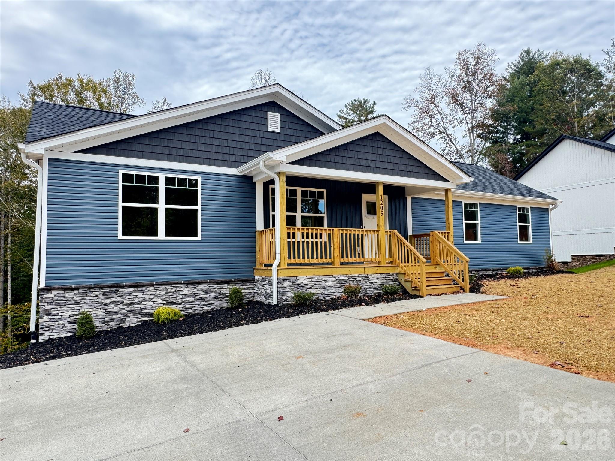 Very nice new construction 6 bed, 3 full bath home located in a beautiful hilly neighborhood offering plenty of privacy. Estimated completion 7/31/25. The main level features soft-close cabinets, wood-look vinyl and carpet flooring, granite countertops in the kitchen and bathrooms, an open floorplan with a deck off the kitchen, and a separate laundry room. The full basement includes a walk-out porch with steps to the backyard, 2 additional bedrooms, 1 full bath, and storage areas. This is a very nice home with great space and quality finishes. Listing agent has ownership in the property.