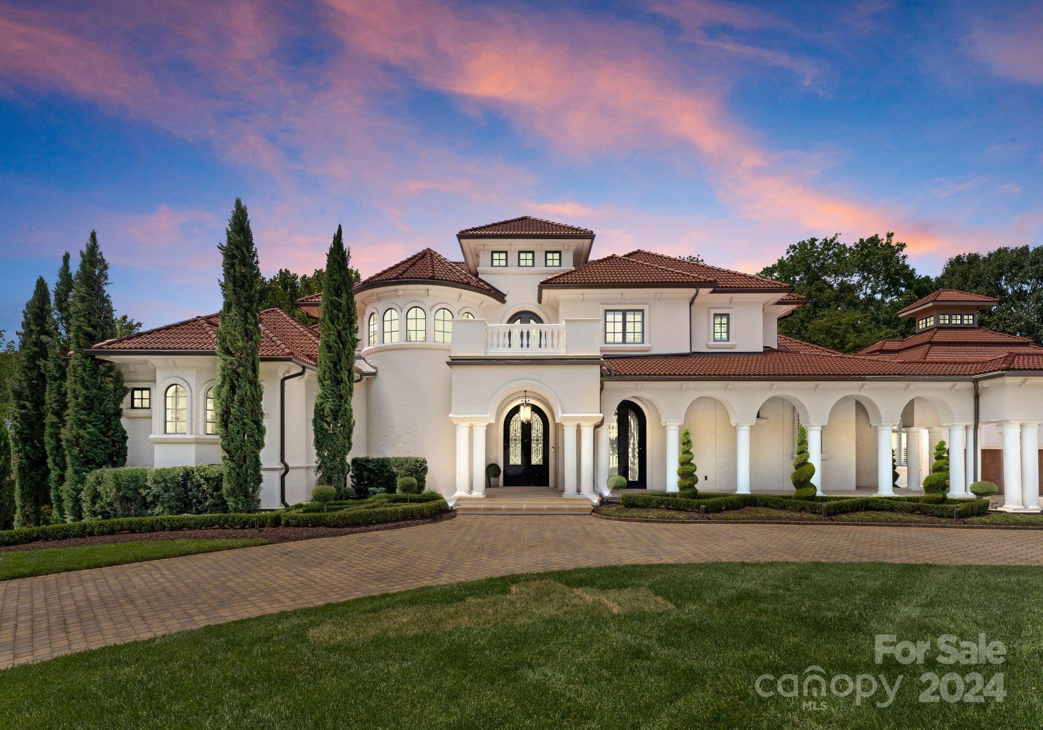 Custom home in the exclusive Seven Eagles gated community. Recently renovated with exceptional attention to detail, this Mediterranean-style residence features a formal great room filled with natural light and highlighted architectural details. The chef’s kitchen boasts a large island, custom cabinets, and top-of-the-line Thermador/Sub-Zero appliances. Breakfast and family rooms open to a covered outdoor terrace. The large primary suite on the main floor includes a sitting room with a fireplace and a luxurious bath with an oversized shower. The home features six en-suite bedrooms with four on the upper level. The lower-level walkout offers a spectacular view and direct access to the covered pool and yard. Outdoor living includes a pool, outdoor kitchen, and dining terrace on a veranda overlooking the professionally landscaped yard. Inside, the lower level is perfect for entertaining, with a large family room, media room, exercise room, recreation room, wine cellar, and bar.